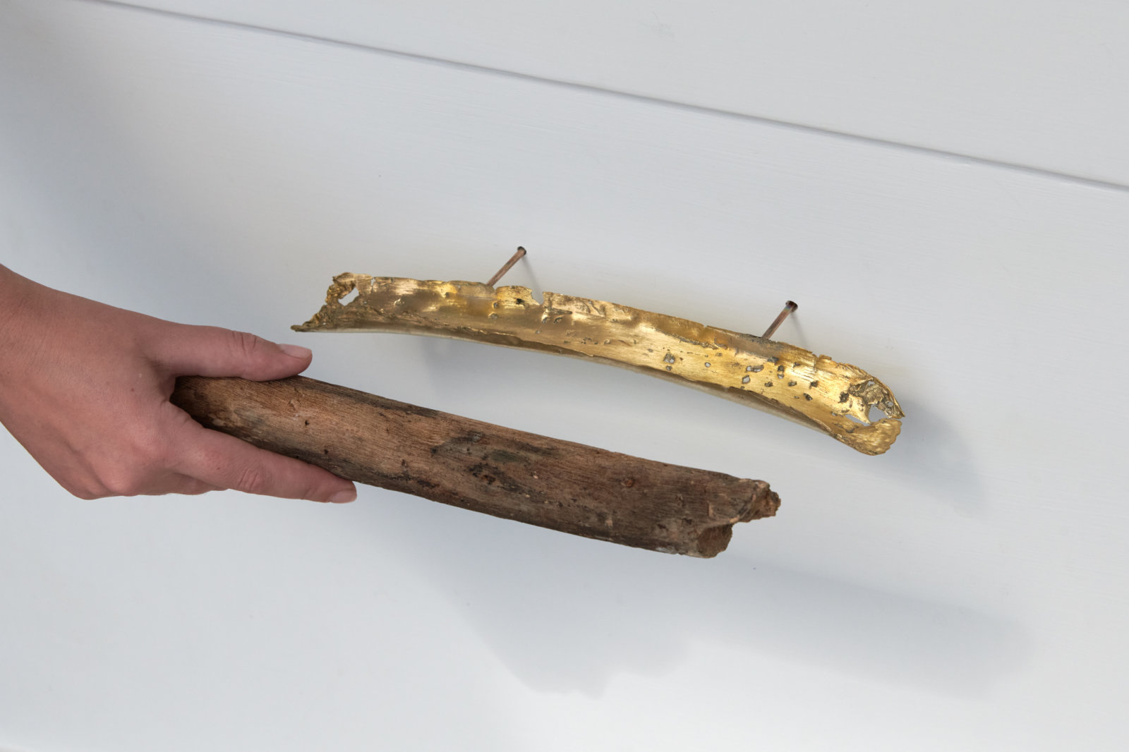Abbas Akhavan, IT, 2022–ongoing, cast brass, found stick, 2 x 12 x 2 in. (5 x 29 x 4 cm)