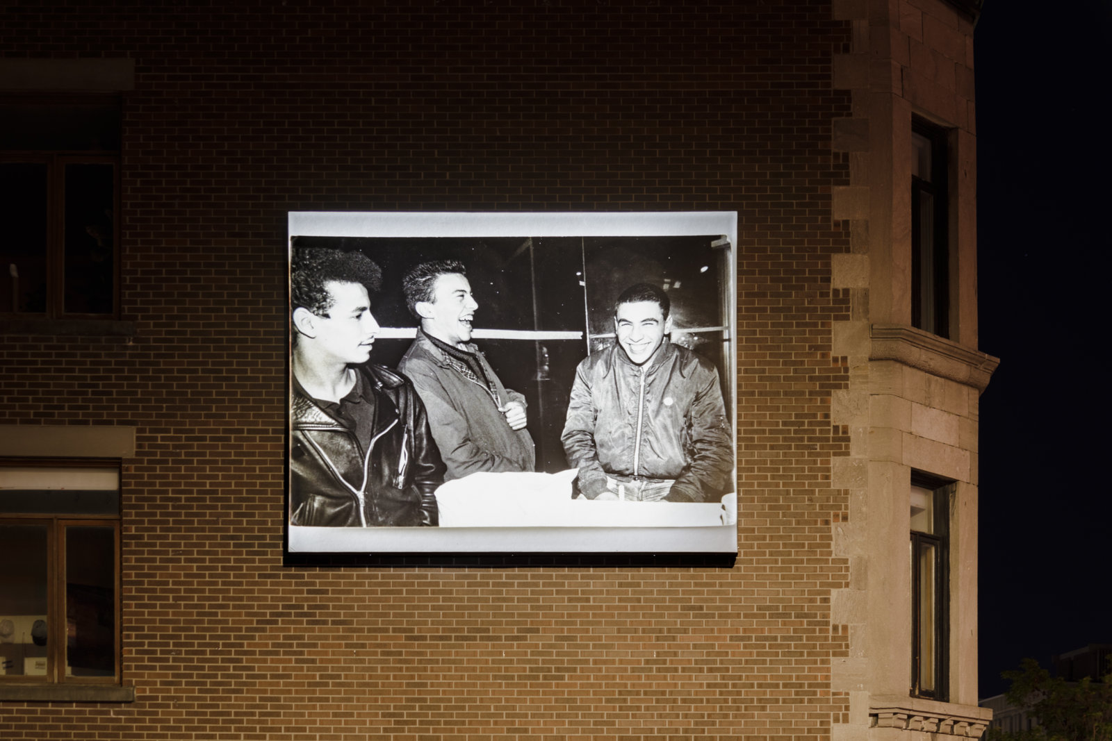 Abbas Akhavan, Omay, Djamal, Albert. hiver 1982, 2023, digital inkjet print on billboard. Installation view, Café Cherrier, Dazibao Satellite, Montreal, Canada, 2023