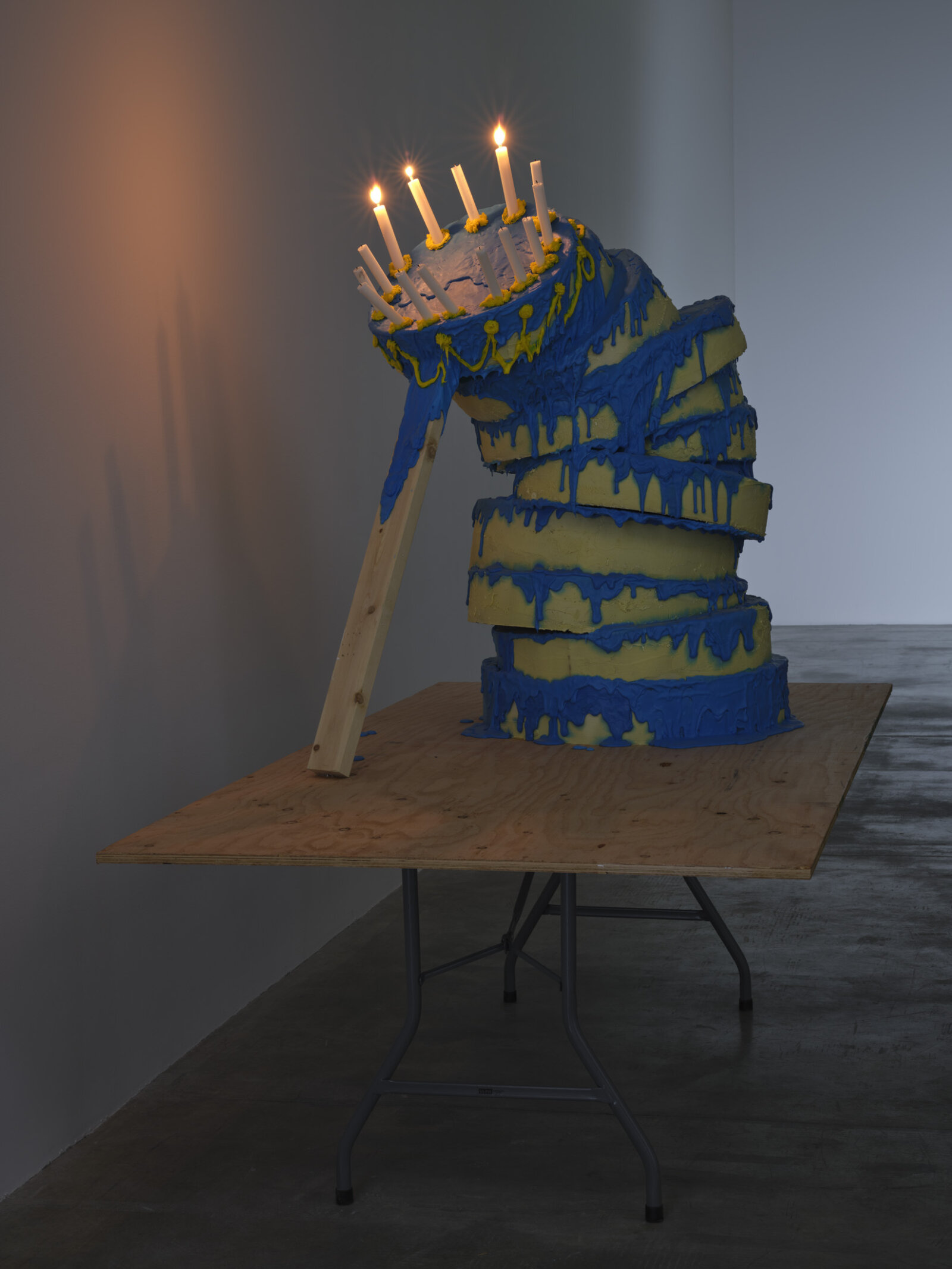 Abbas Akhavan, One Hundred Years, 2025, royal icing (confectioners’ sugar, egg whites, food colouring), stainless steel, hardware, oil lamp, paraffin oil, candles, lumber, dimensions variable. Installation view, One Hundred Years, Morris and Helen Belkin Art Gallery, Vancouver, Canada, 2025