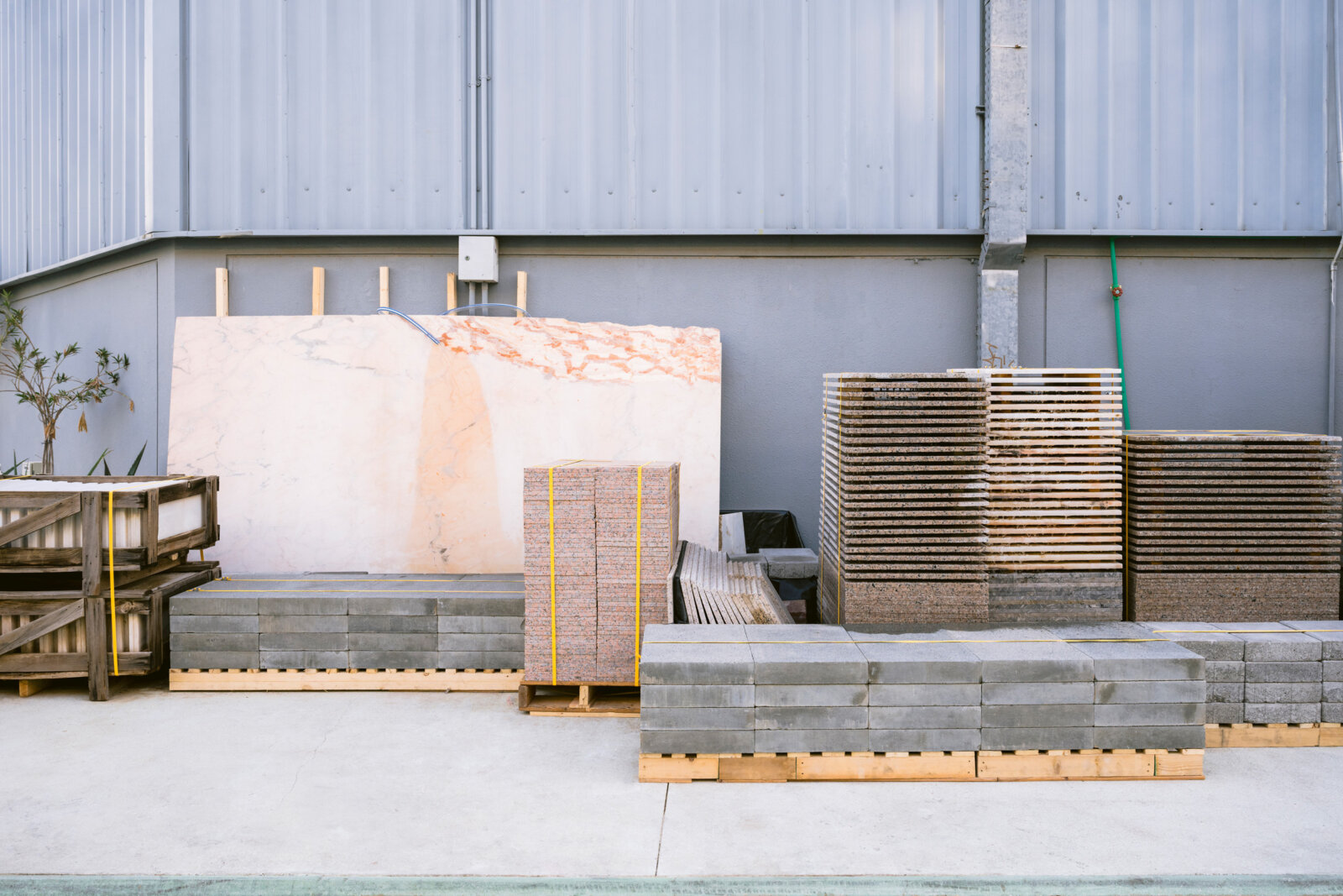 Abbas Akhavan, Stock: Variation on a Fountain, 2024, construction materials sourced from Alserkal’s storage, wood, piping, hose, pond pumps, pond liner, water, dimensions variable. Installation view, Walk With Me, Alskeral Arts Foundation, Dubai, UAE, 2024