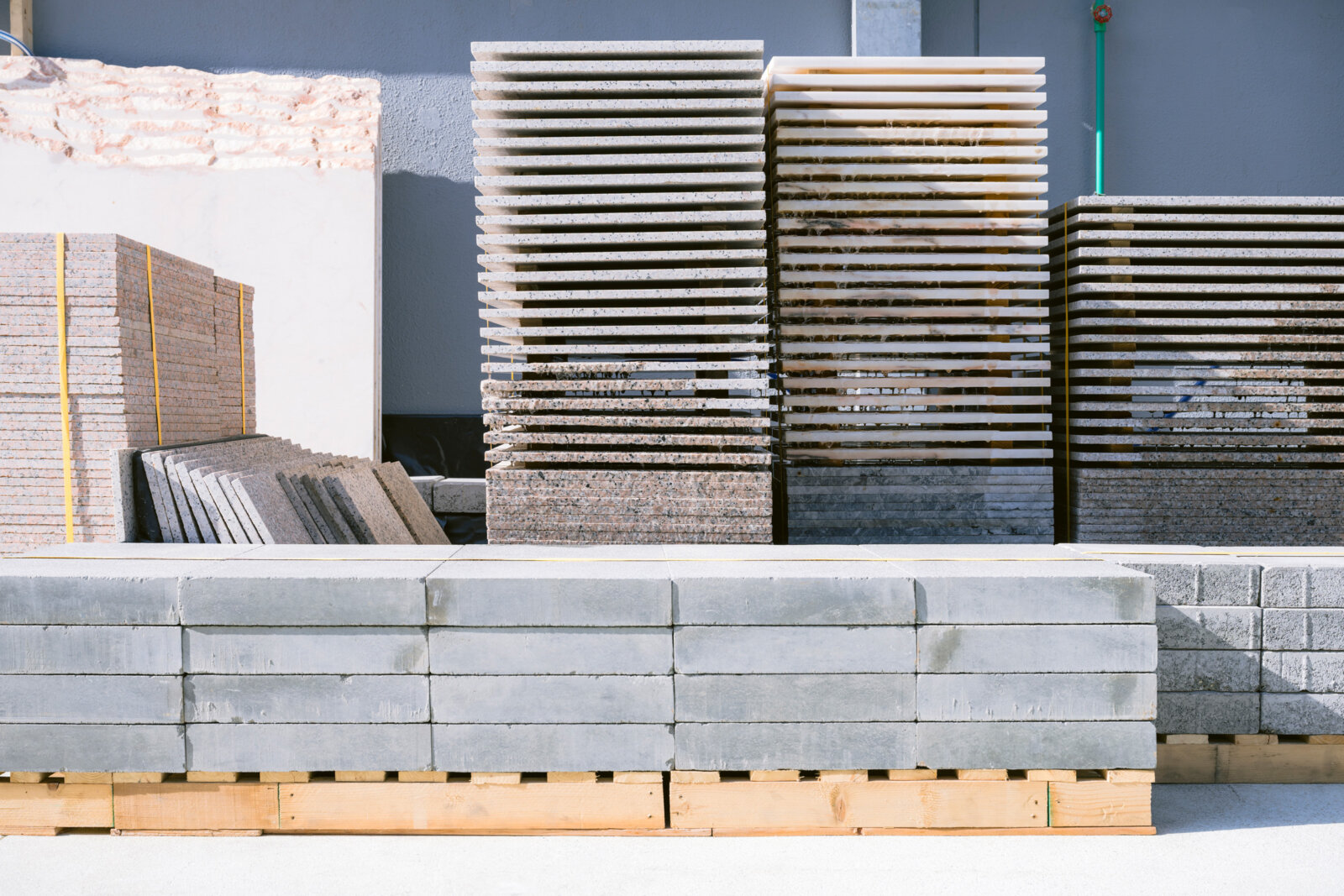 Abbas Akhavan, Stock: Variation on a Fountain, 2024, construction materials sourced from Alserkal’s storage, wood, piping, hose, pond pumps, pond liner, water, dimensions variable. Installation view, Walk With Me, Alskeral Arts Foundation, Dubai, UAE, 2024