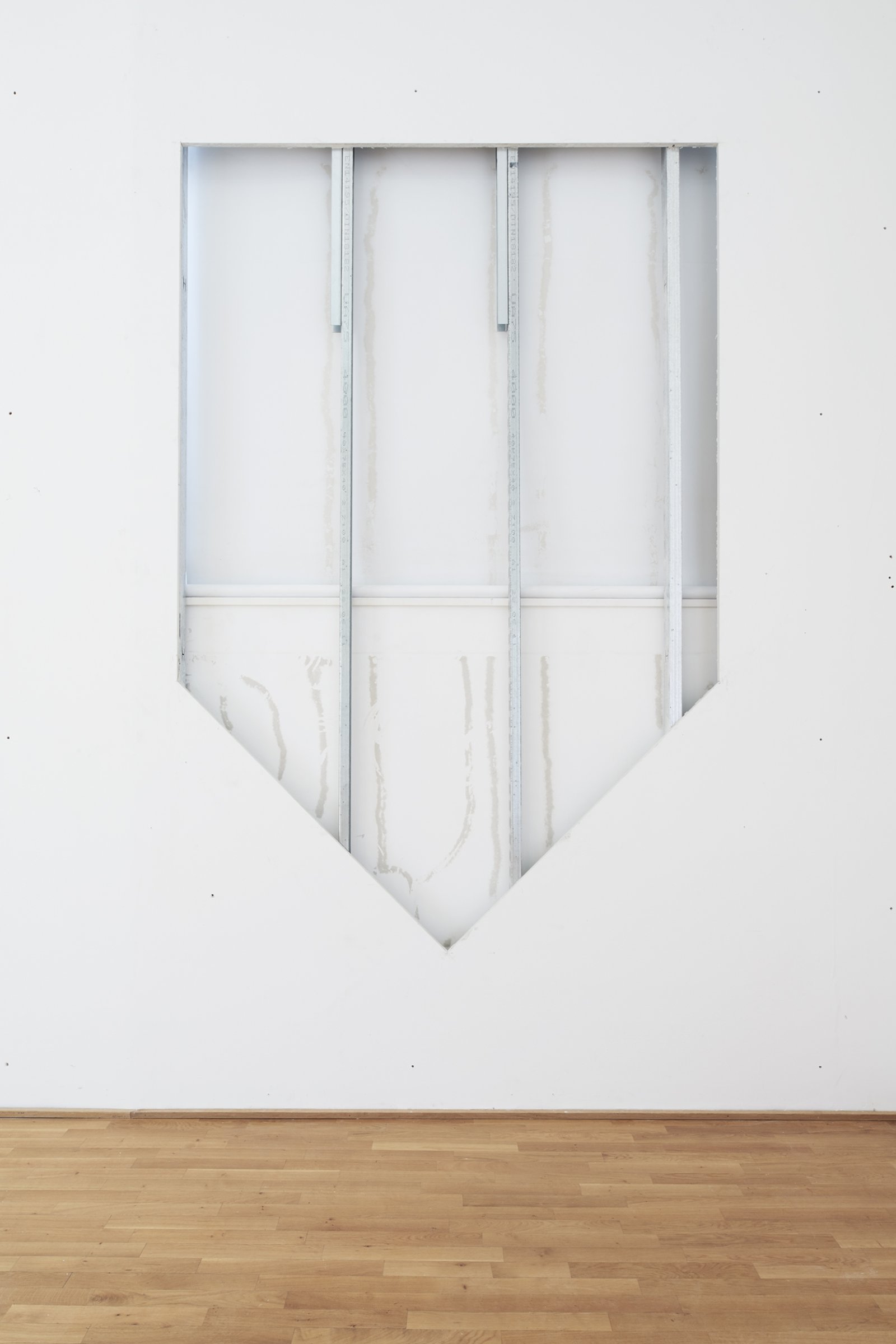 Abbas Akhavan, Study for a Blue Shield, 2010–2017, gallery wall cut, painted and displayed on the roof of the exhibition space, 118 x 98 in. (300 x 250 cm). Installation view, Museum Villa Stuck, Munich, Germany, 2017