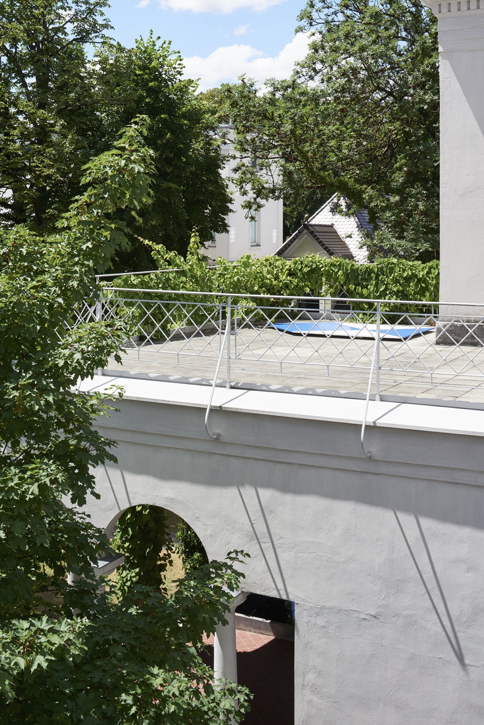 Abbas Akhavan, Study for a Blue Shield, 2010–2017, gallery wall cut, painted and displayed on the roof of the exhibition space, 118 x 98 in. (300 x 250 cm). Installation view, Museum Villa Stuck, Munich, Germany, 2017