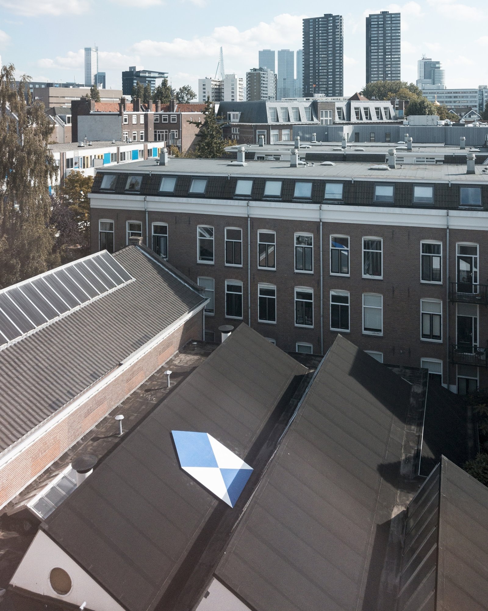 Abbas Akhavan, Study for a Blue Shield, 2010–2017, gallery wall cut, painted and displayed on the roof of the exhibition space, (300 x 250 cm). Installation view, Art in the Age of Asymmetrical Warfare, Witte de With, Rotterdam, The Netherlands, 2015