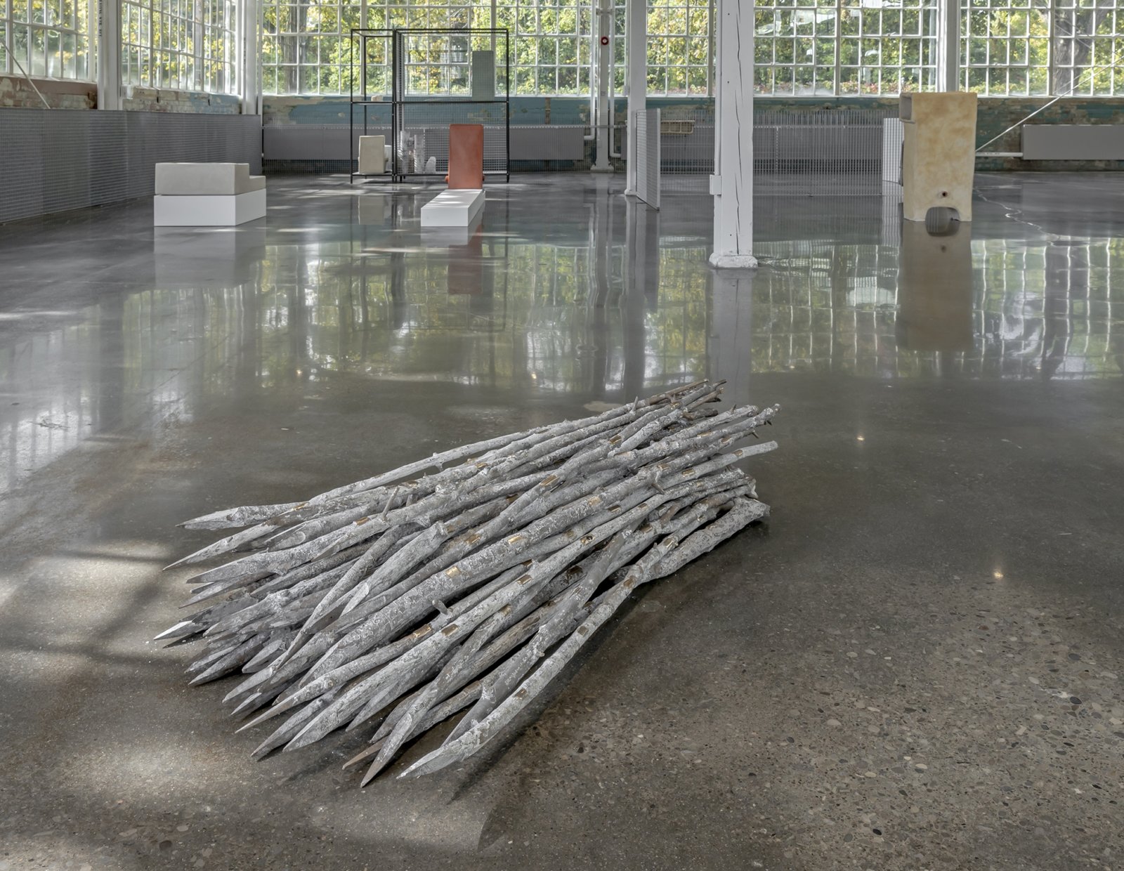 Abbas Akhavan, Study for a Garden, 2017, bronze, 50 unique pieces, each 47 x 2 x 2 in. (120 x 5 x 5 cm). Installation view, The Shoreline Dilemma, Toronto Biennial of Art, Small Arms Inspection Building, Toronto, Canada, 2019