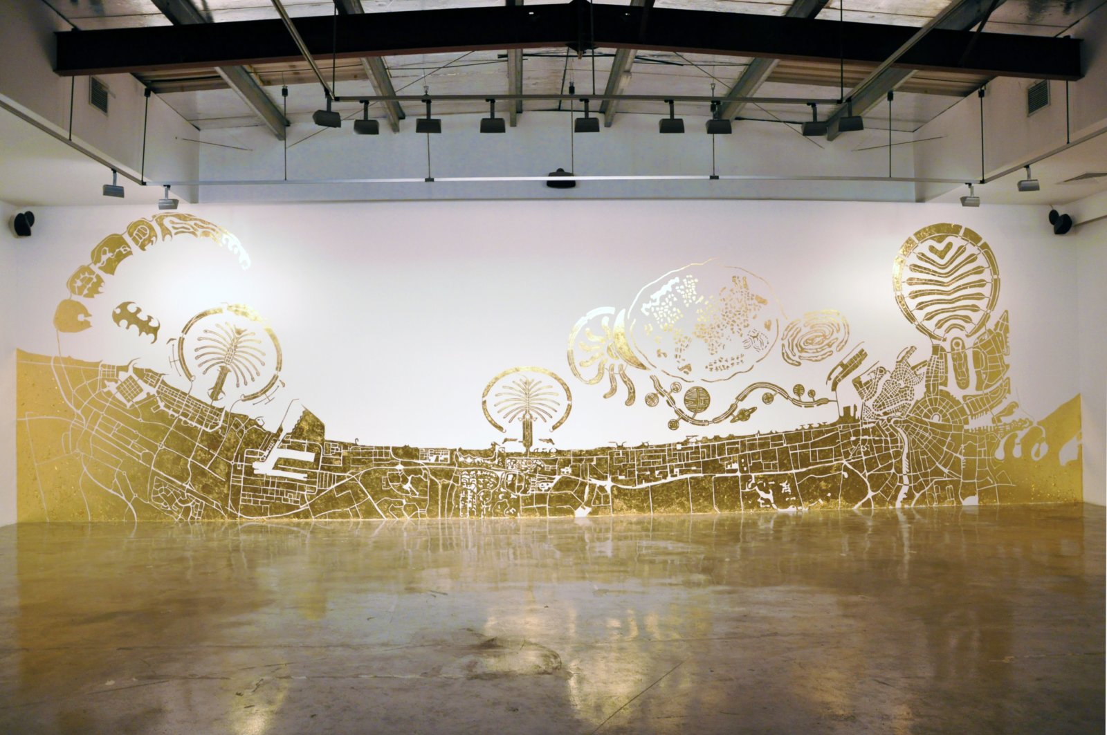 Abbas Akhavan, Study for a Map, 2010, imitation gold leaf on gallery wall, 157 x 551 in. (400 x 1400 cm). Installation view, Islands, The Third Line, Dubai, UAE, 2010