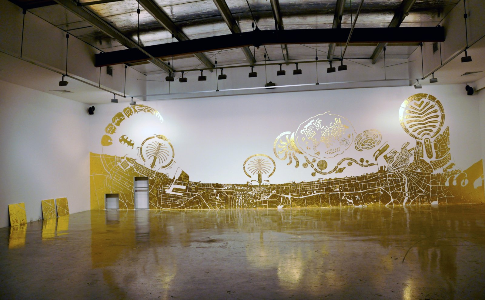 Abbas Akhavan, Study for a Map, 2010, imitation gold leaf on gallery wall, 157 x 551 in. (400 x 1400 cm). Installation view, Islands, The Third Line, Dubai, UAE, 2010