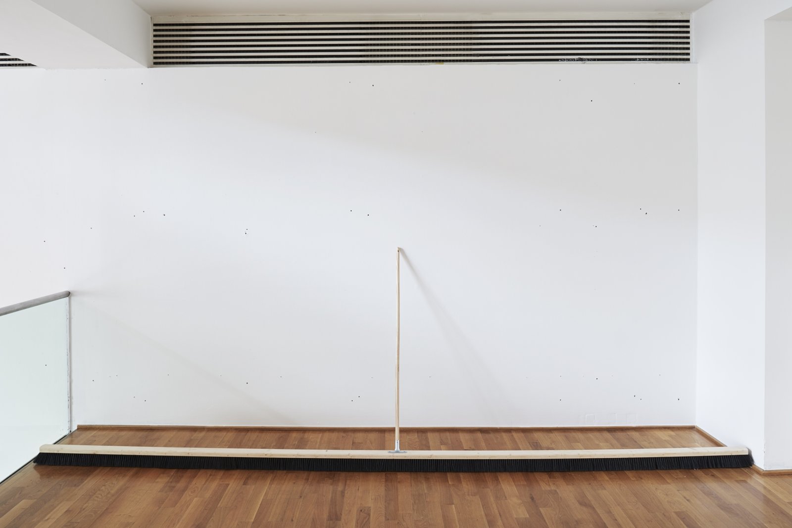 Abbas Akhavan, Push Broom, 2017, wood, horsehair, aluminum, 59 x 173 x 3 in. (150 x 440 x 8 cm). Installation view, Museum Villa Stuck, Munich, Germany, 2017