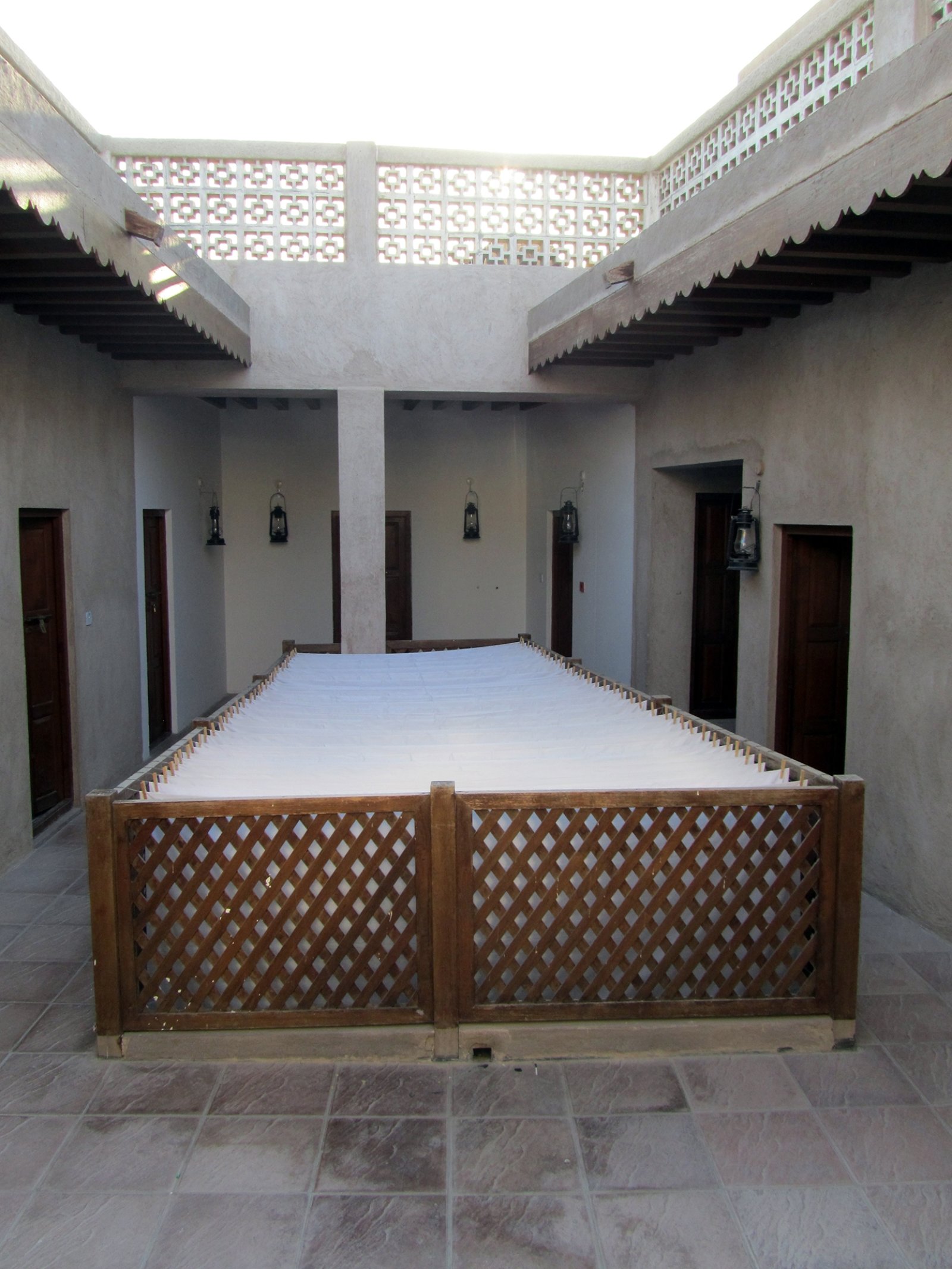 Abbas Akhavan, Variations on Ghosts and Guests: Curtains, 2011, cotton bedsheets, rope, clothespins, dimensions variable. Installation view, Variations on Ghosts and Guests, Delfina Foundation, Dubai, UAE, 2011