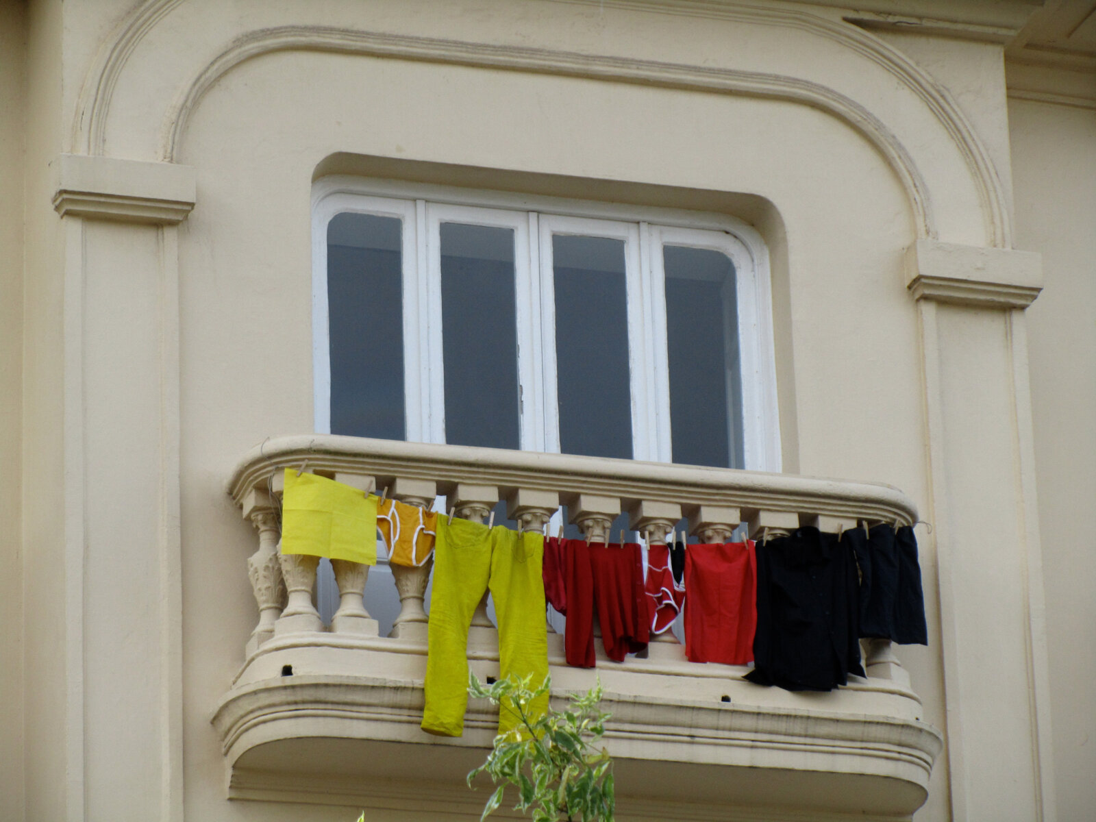 Abbas Akhavan, Variations on Laundry, June 7th and June 11th, 2010, various clothing hung from studio balcony, colours of the garments corresponded with the flags of the teams playing against Spain during FIFA World Cup Finales, dimensions variable. Installation view, Fundación Botín, Santander, Spain, 2010