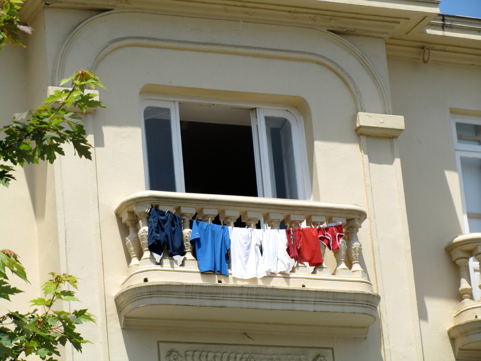 Abbas Akhavan, Variations on Laundry, June 7th and June 11th, 2010, various clothing hung from studio balcony, colours of the garments corresponded with the flags of the teams playing against Spain during FIFA World Cup Finales, dimensions variable. Installation view, Fundación Botín, Santander, Spain, 2010