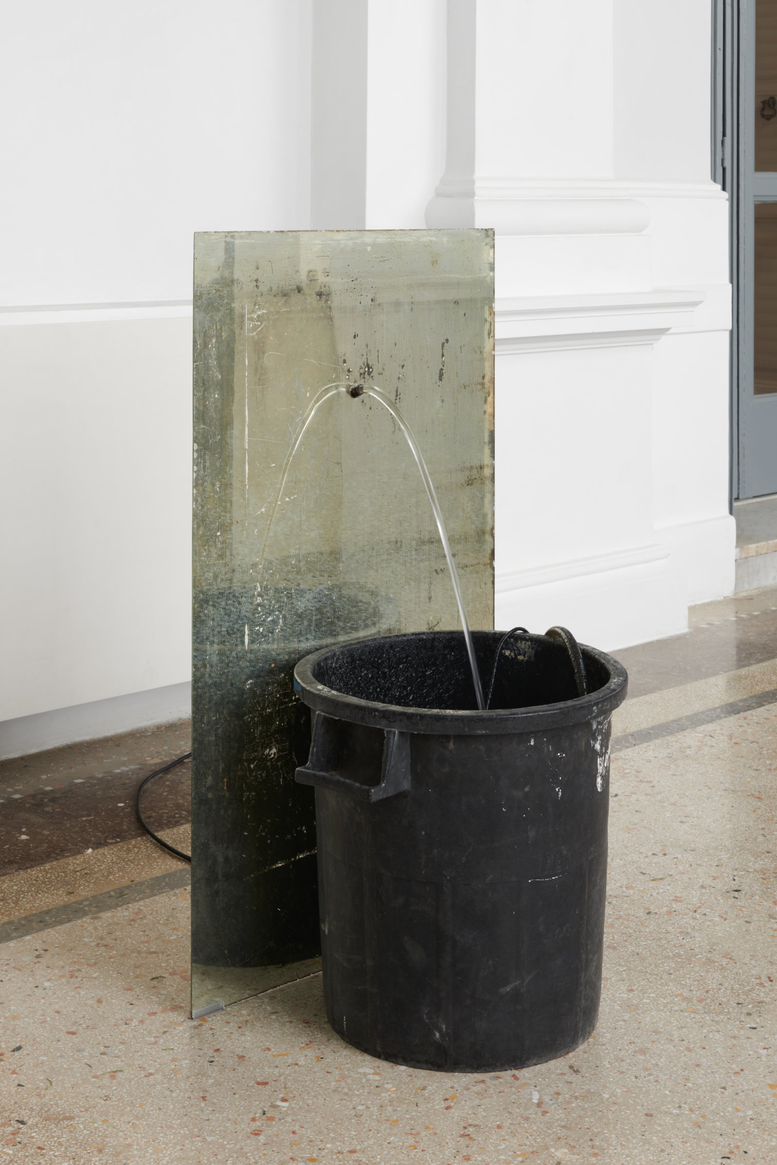 Abbas Akhavan, fountain, 2022, plastic bin, mirror, pond pump, tubing, water, snail mucin serum, Glantamine, 41 x 24 x 19 in. (105 x 60 x 48 cm). Installation view, Mettere al mondo il mondo, Thomas Dane Gallery, Naples, Italy, 2022