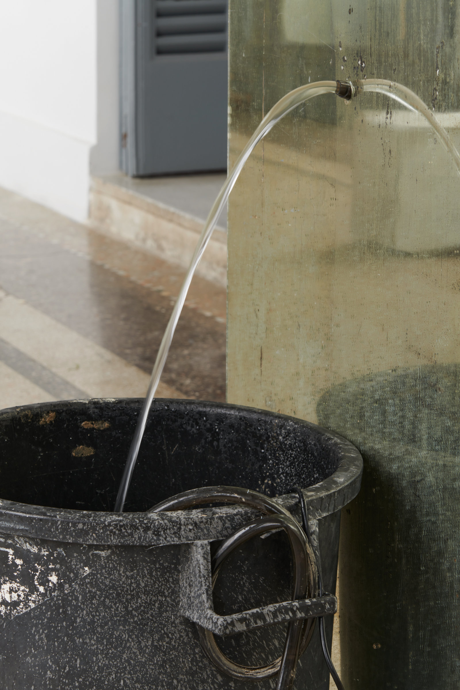 Abbas Akhavan, fountain (detail), 2022, plastic bin, mirror, pond pump, tubing, water, snail mucin serum, Glantamine, 41 x 24 x 19 in. (105 x 60 x 48 cm). Installation view, Mettere al mondo il mondo, Thomas Dane Gallery, Naples, Italy, 2022