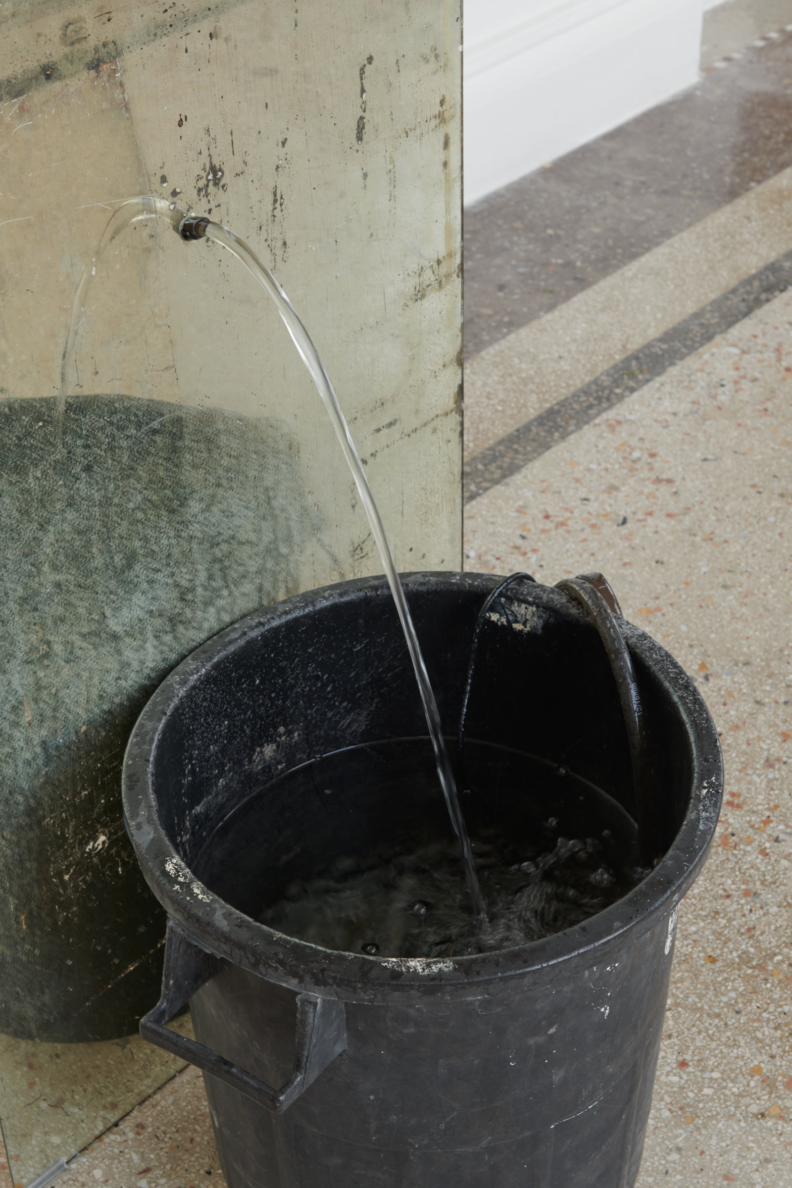 Abbas Akhavan, fountain (detail), 2022, plastic bin, mirror, pond pump, tubing, water, snail mucin serum, Glantamine, 41 x 24 x 19 in. (105 x 60 x 48 cm). Installation view, Mettere al mondo il mondo, Thomas Dane Gallery, Naples, Italy, 2022