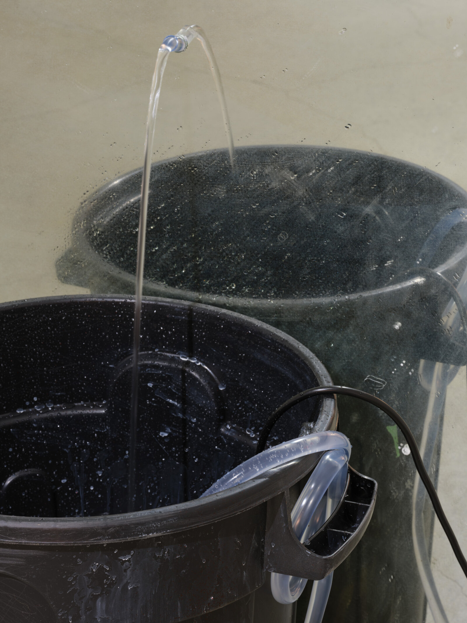 Abbas Akhavan, fountain (detail), 2022, plastic bin, mirror, pond pump, tubing, water, snail mucin serum, Galantamine, 42 x 28 x 20 in. (107 x 71 x 51 cm)