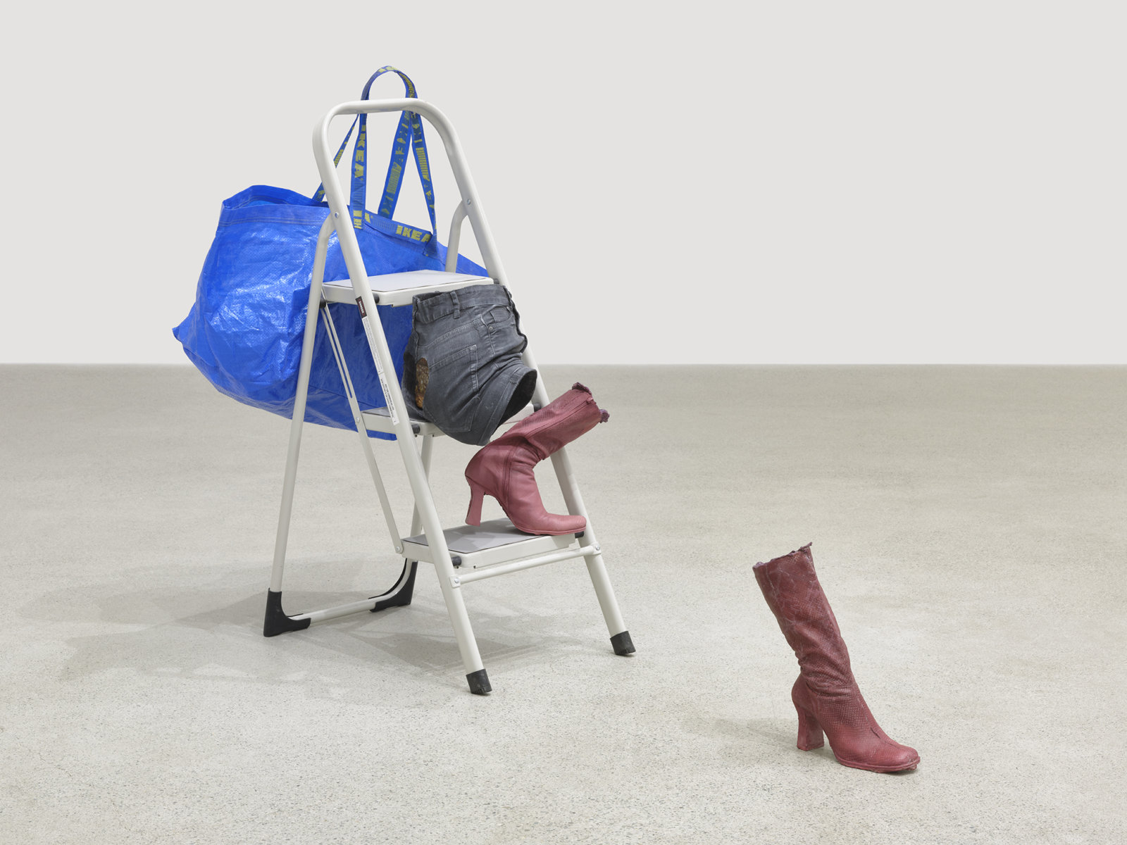 Valérie Blass, Ceux qui ne demandent rien, 2019, stool, acrylic, oil, gouache, fibreglass, brick, shopping bag, cheetos, popcorn, milk carton, kraft dinner, apple juice, kitchen sponges, scouring pad, 44 x 66 x 33 in. (112 x 168 x 84 cm)