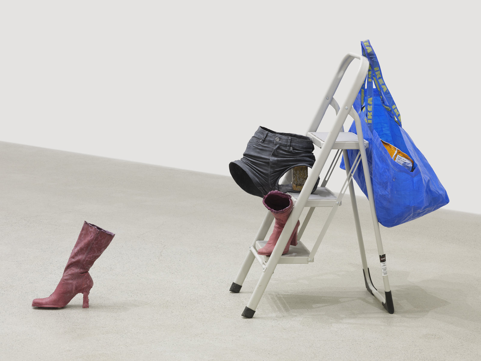 Valérie Blass, Ceux qui ne demandent rien, 2019, stool, acrylic, oil, gouache, fibreglass, brick, shopping bag, cheetos, popcorn, milk carton, kraft dinner, apple juice, kitchen sponges, scouring pad, 44 x 66 x 33 in. (112 x 168 x 84 cm)