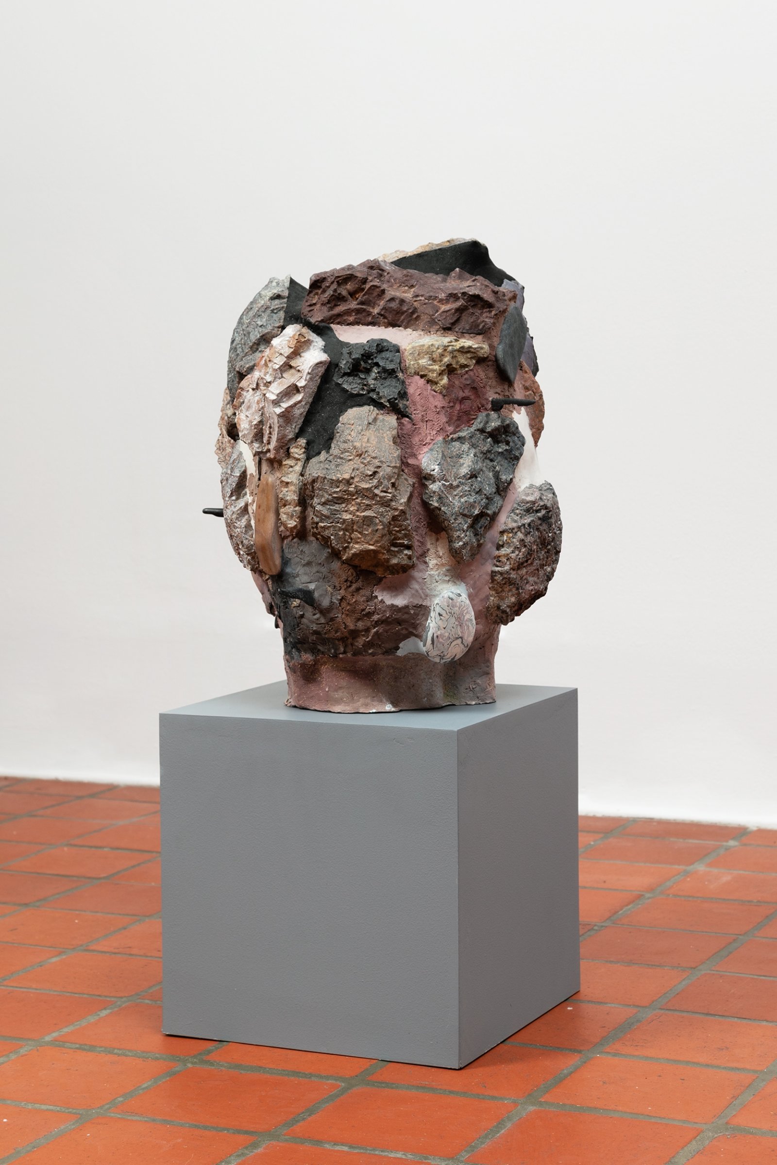 Valérie Blass, Head Guston, 2014, polystyrene, plaster, rock, magic sculpt, paint, sand, 17 x 16 x 15 in. (43 x 41 x 37 cm). Installation view, The Mime, the Model and the Dupe, Oakville Galleries, Oakville, 2019