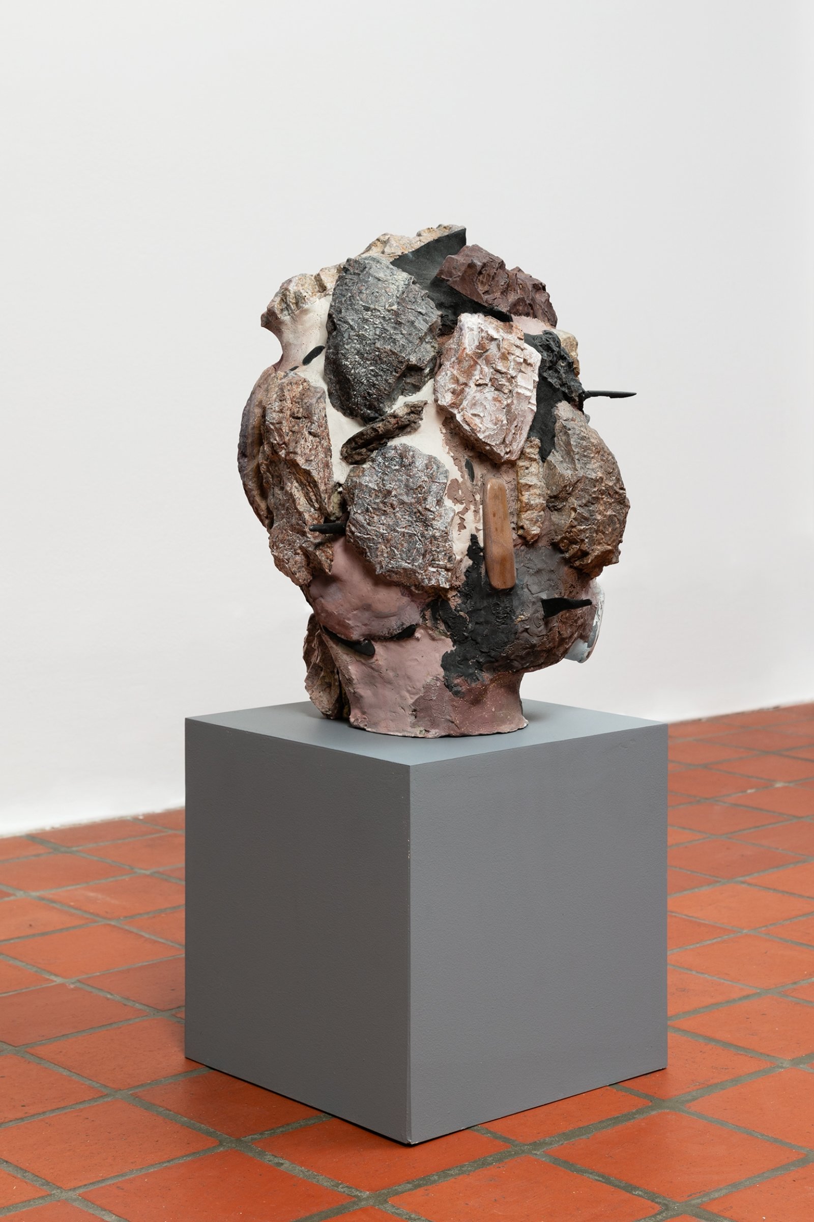 Valérie Blass, Head Guston, 2014, polystyrene, plaster, rock, magic sculpt, paint, sand, 17 x 16 x 15 in. (43 x 41 x 37 cm). Installation view, The Mime, the Model and the Dupe, Oakville Galleries, Oakville, 2019