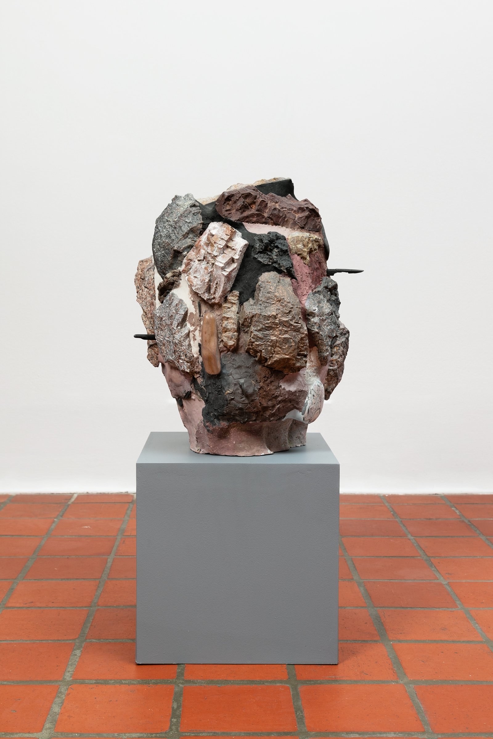 Valérie Blass, Head Guston, 2014, polystyrene, plaster, rock, magic sculpt, paint, sand, 17 x 16 x 15 in. (43 x 41 x 37 cm). Installation view, The Mime, the Model and the Dupe, Oakville Galleries, Oakville, 2019