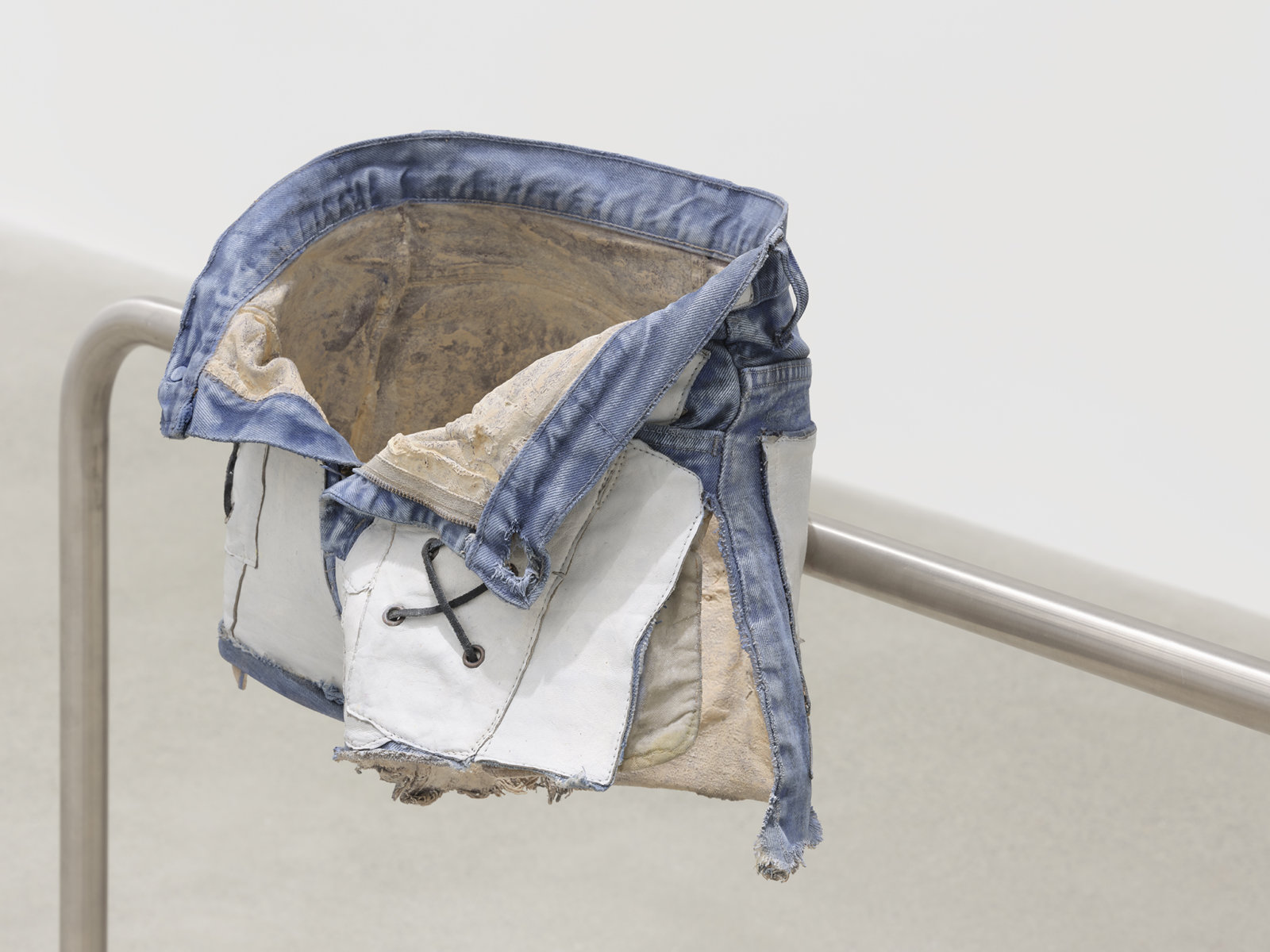 Valérie Blass, L’homme réparé (detail), 2019, stainless steel, denim shorts, epoxy resin, acrylic paint, 41 x 89 x 12 in. (104 x 226 x 31 cm)