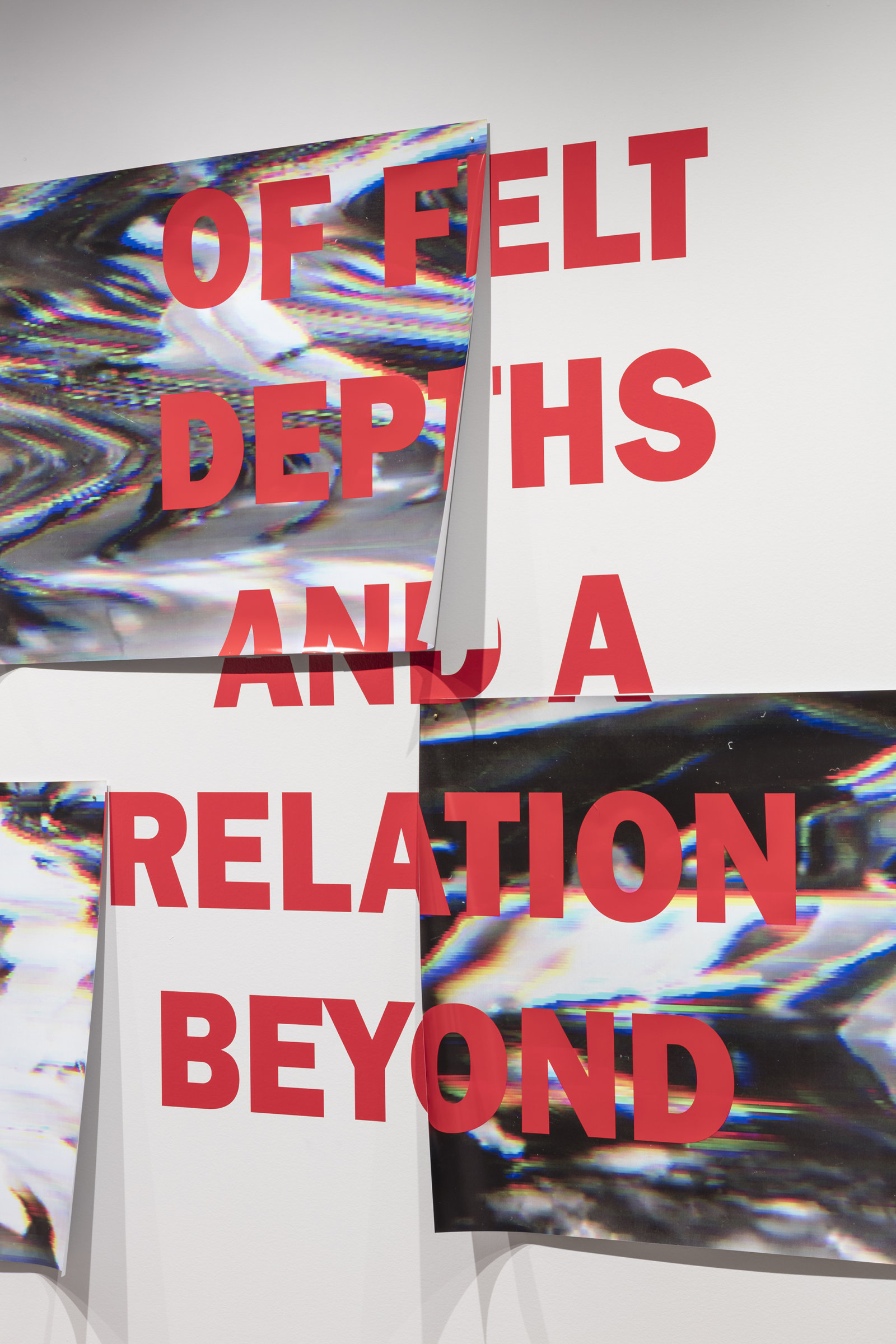 Raymond Boisjoly, Of felt depths and a relation beyond, 2016, vinyl lettering on solvent based inkjet print on vinyl, 63 x 102 in. (160 x 258 cm). Installation view, Over a Distance Between One and Many, Koffler Gallery, Toronto, ON, 2016