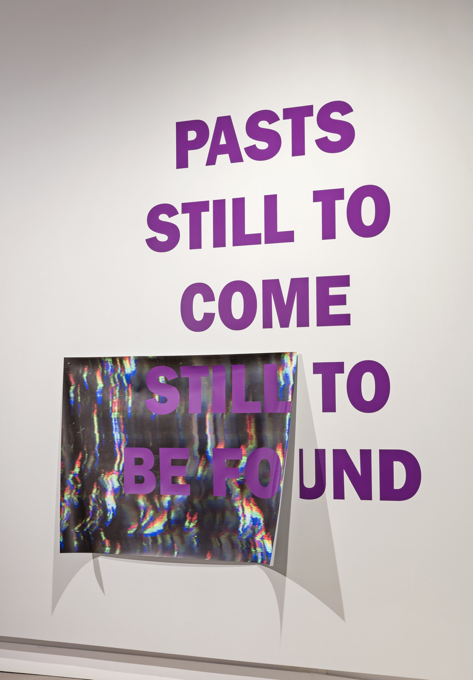 Raymond Boisjoly, Pasts still to come still to be found, 2016, vinyl lettering on solvent based inkjet print on vinyl, 65 x 57 in. (164 x 146 cm). Installation view, Over a Distance Between One and Many, Koffler Gallery, Toronto, ON, 2016