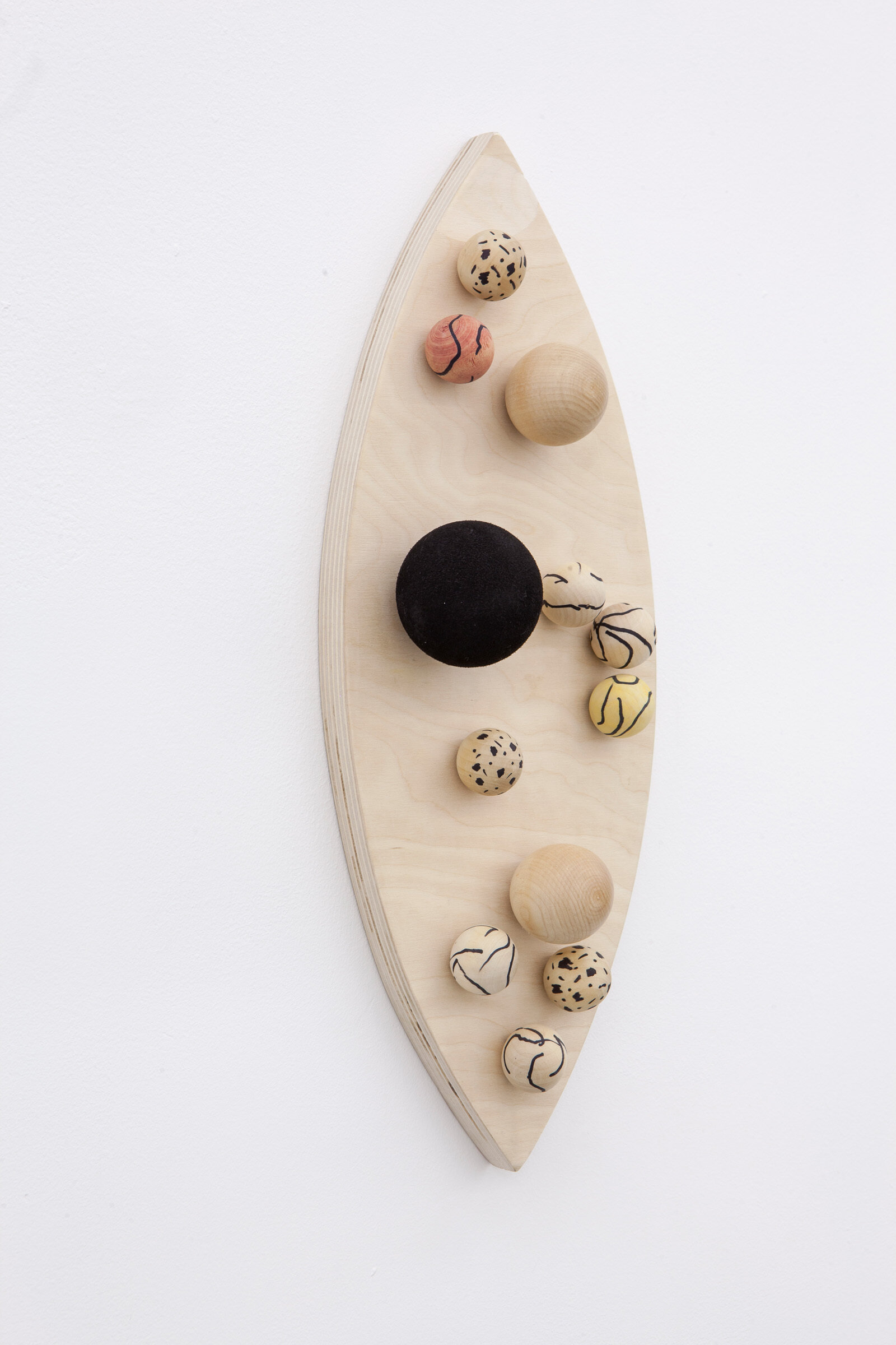 Eli Bornowsky, Yoni, 2013, gouache, marker on wood, found ball, 18 x 8 x 2 in. (46 x 20 x 5 cm)