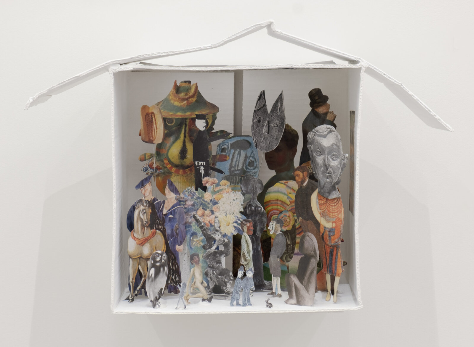 Geoffrey Farmer, Each Mask Is Another Window, 2024, cardboard, white paint, wire, putty, book cut-outs, 17 x 23 x 11 in. (42 x 58 x 27 cm)