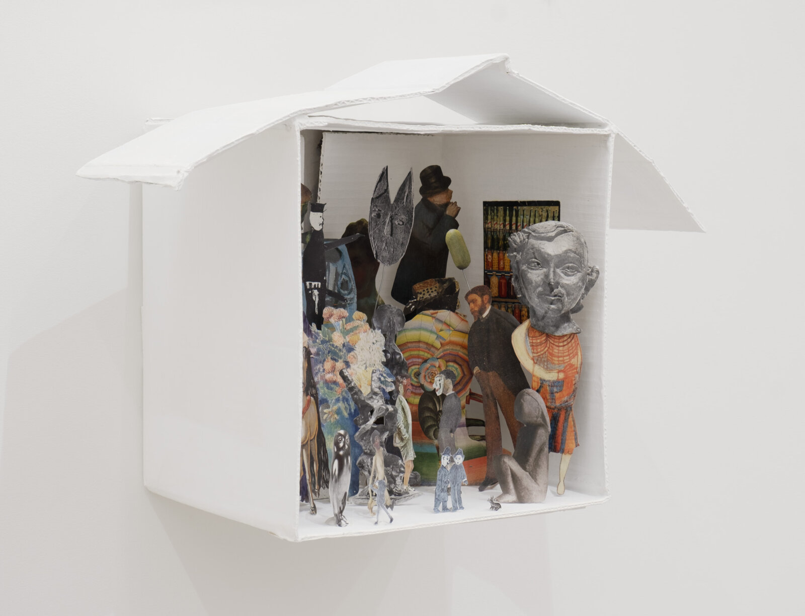 Geoffrey Farmer, Each Mask Is Another Window, 2024, cardboard, white paint, wire, putty, book cut-outs, 17 x 23 x 11 in. (42 x 58 x 27 cm)