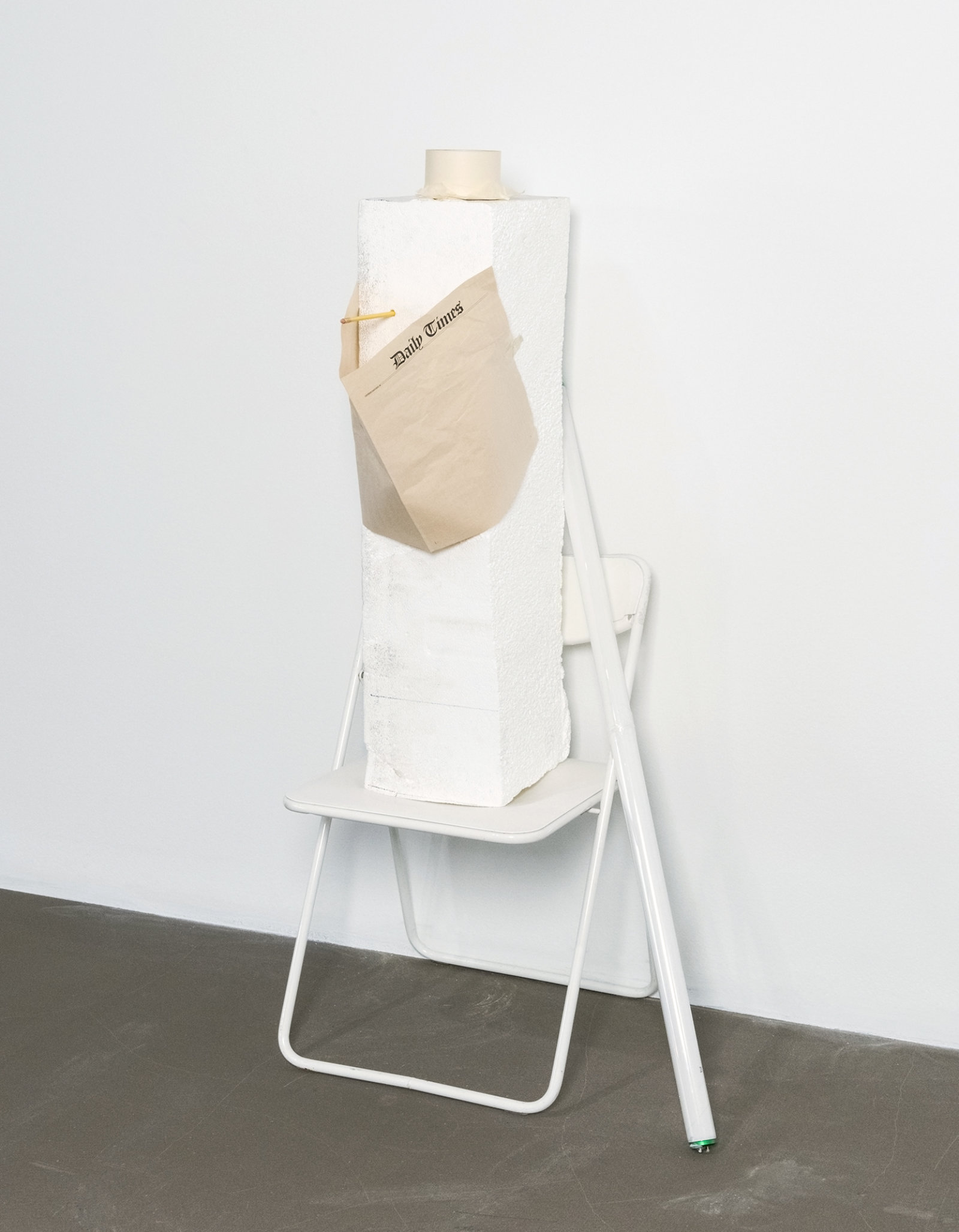 Geoffrey Farmer, I am by nature one and also many, dividing the single me into many, and even opposing them as great and small, light and dark, and in ten thousand other ways (I know what it is like to fall), 2006–2008, white chair, styrofoam, newspaper, tape, pencil, fluorescent bulb, 58 x 21 x 18 in. (147 x 53 x 46 cm)