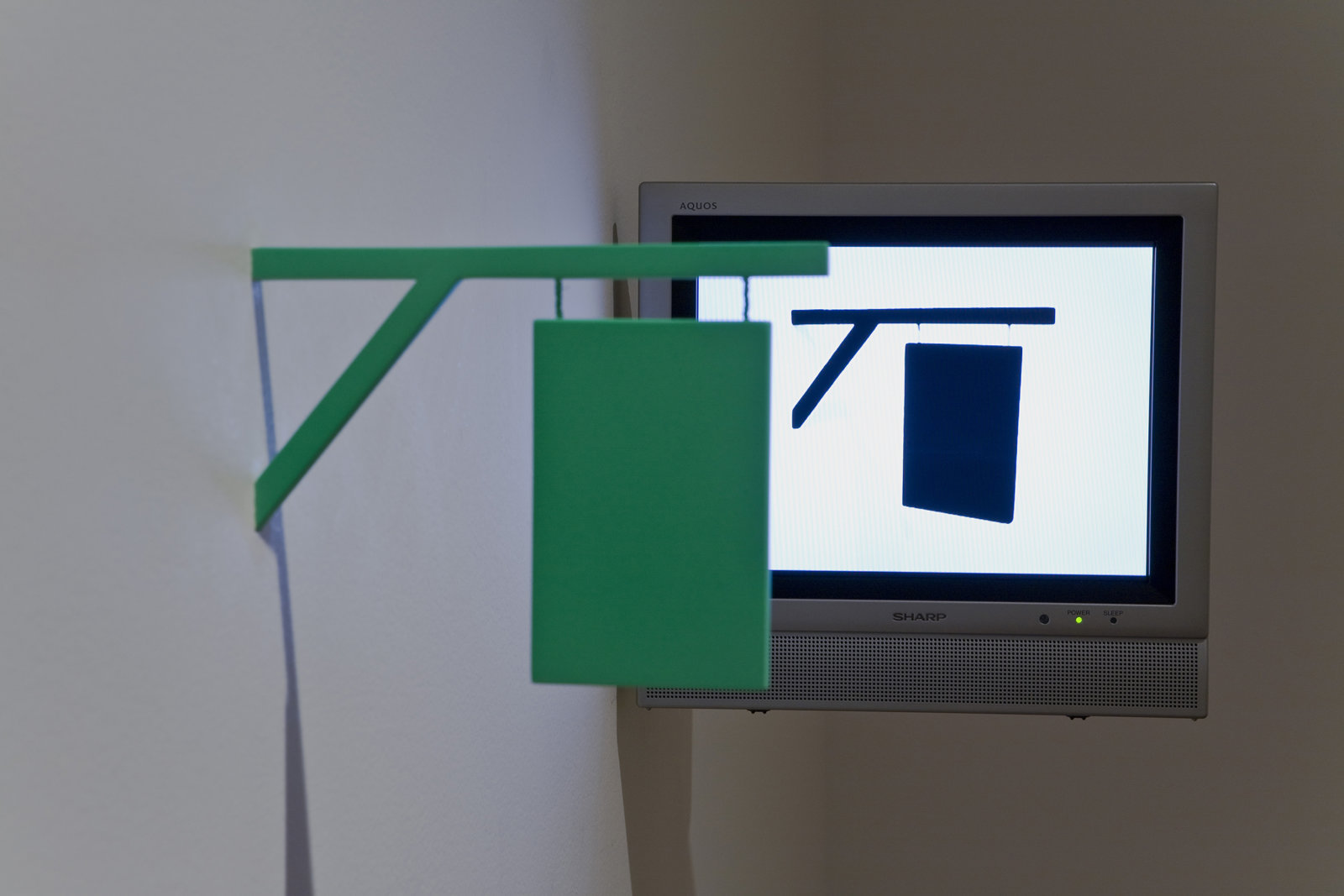 Geoffrey Farmer, I thought that I could make a machine that would pierce the fabric of reality, in your world it appears as a 16th-century sign, 2004, DVD , monitor, sculpture dimensions variable