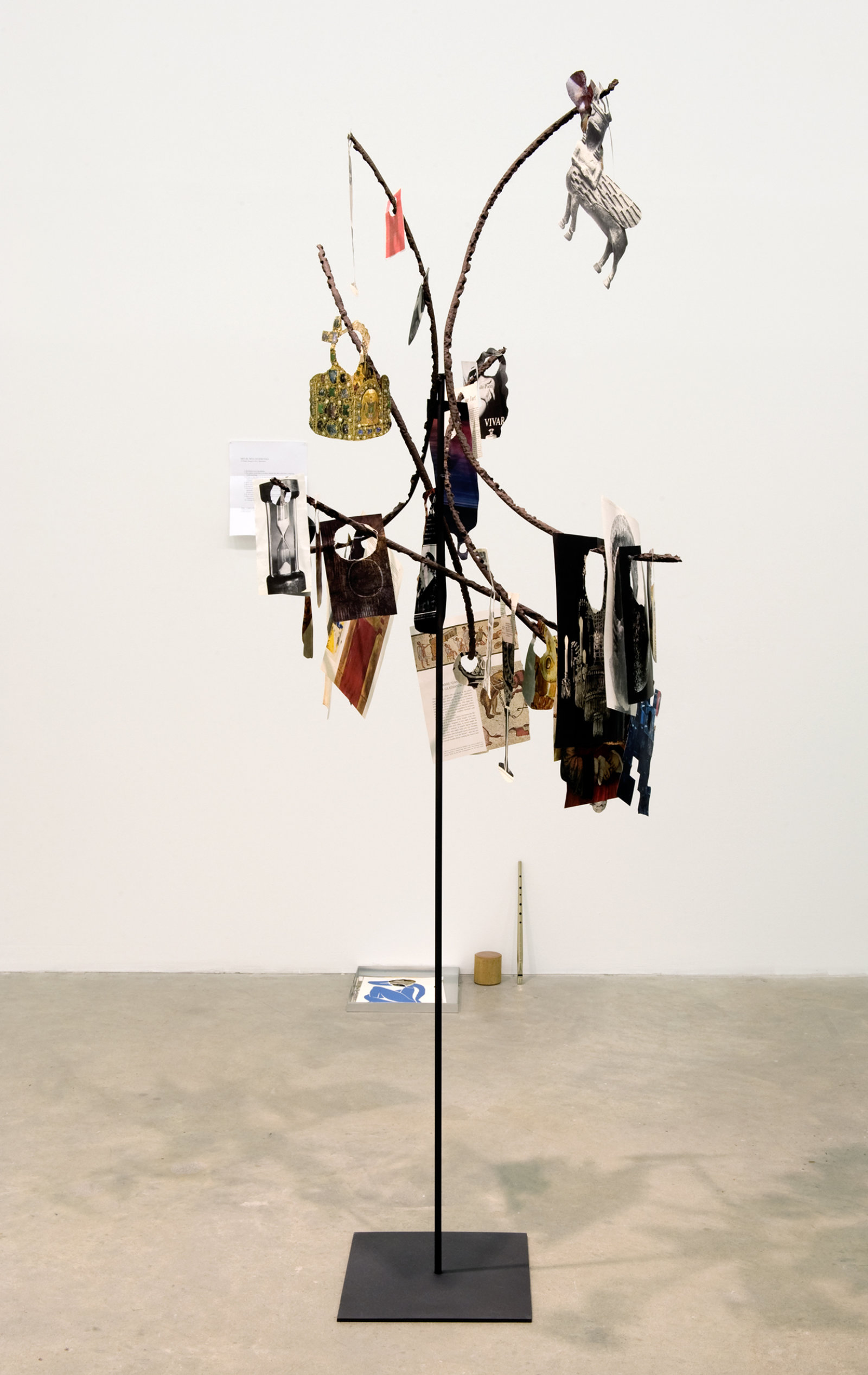 Geoffrey Farmer, Metal Will Stand Tall (A Single Image Is Not A Splendor), 2011–2012, found metal, LIFE Magazine cutouts, rock, wire, 69 x 39 x 28 in. (175 x 99 x 71 cm)