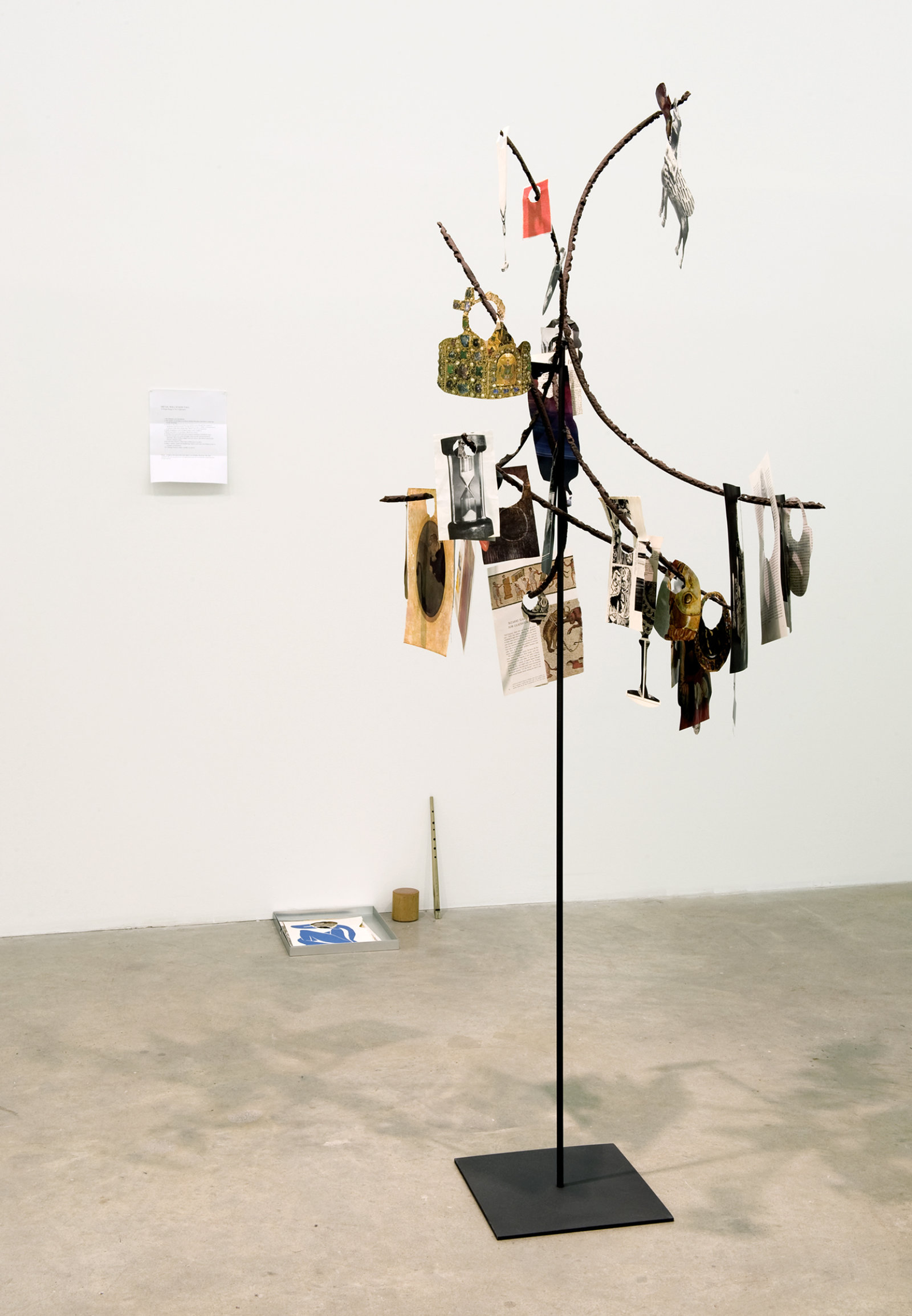 Geoffrey Farmer, Metal Will Stand Tall (A Single Image Is Not A Splendor), 2011–2012, found metal, LIFE Magazine cutouts, rock, wire, 69 x 39 x 28 in. (175 x 99 x 71 cm)