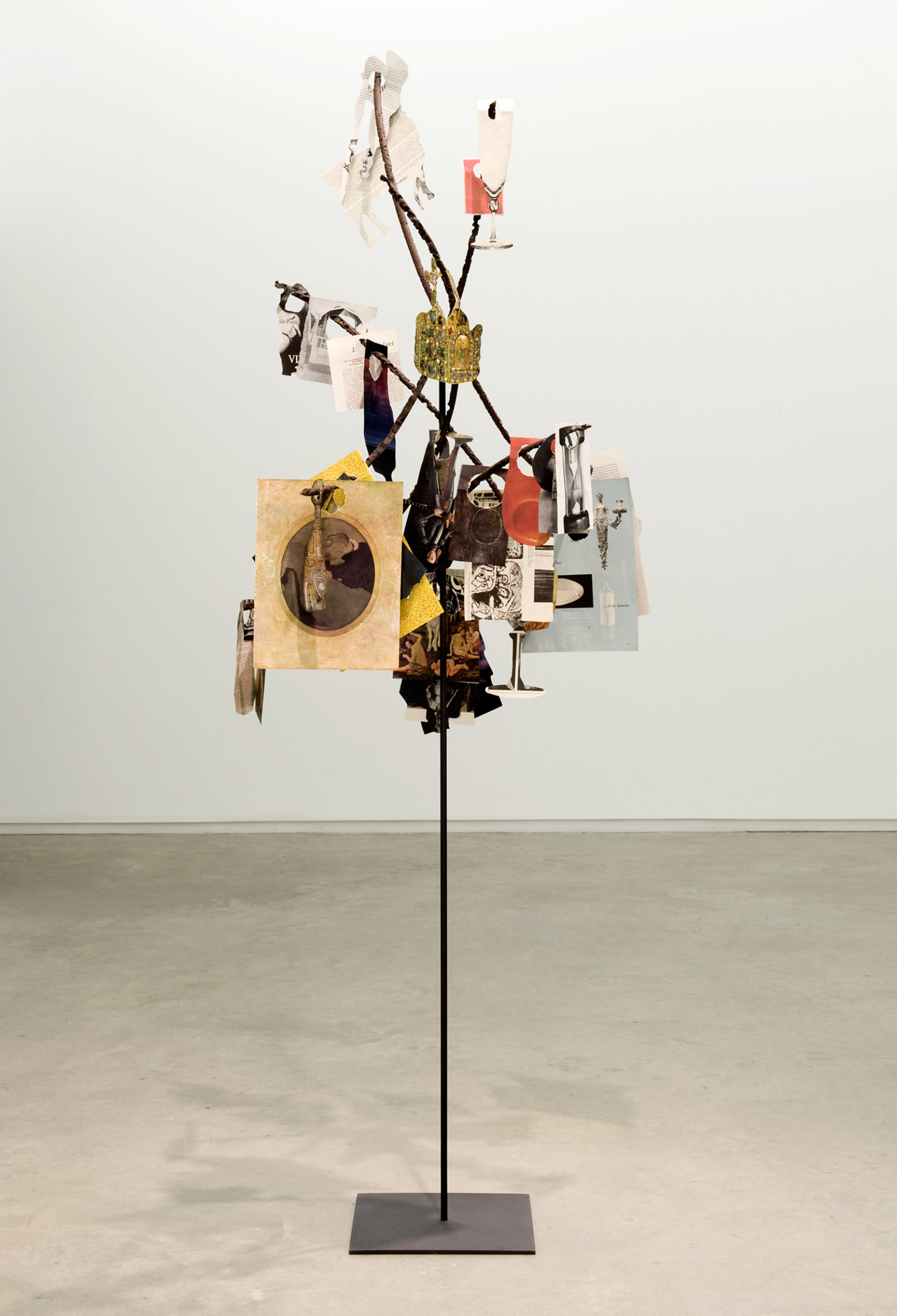 Geoffrey Farmer, Metal Will Stand Tall (A Single Image Is Not A Splendor), 2011–2012, found metal, LIFE Magazine cutouts, rock, wire, 69 x 39 x 28 in. (175 x 99 x 71 cm)