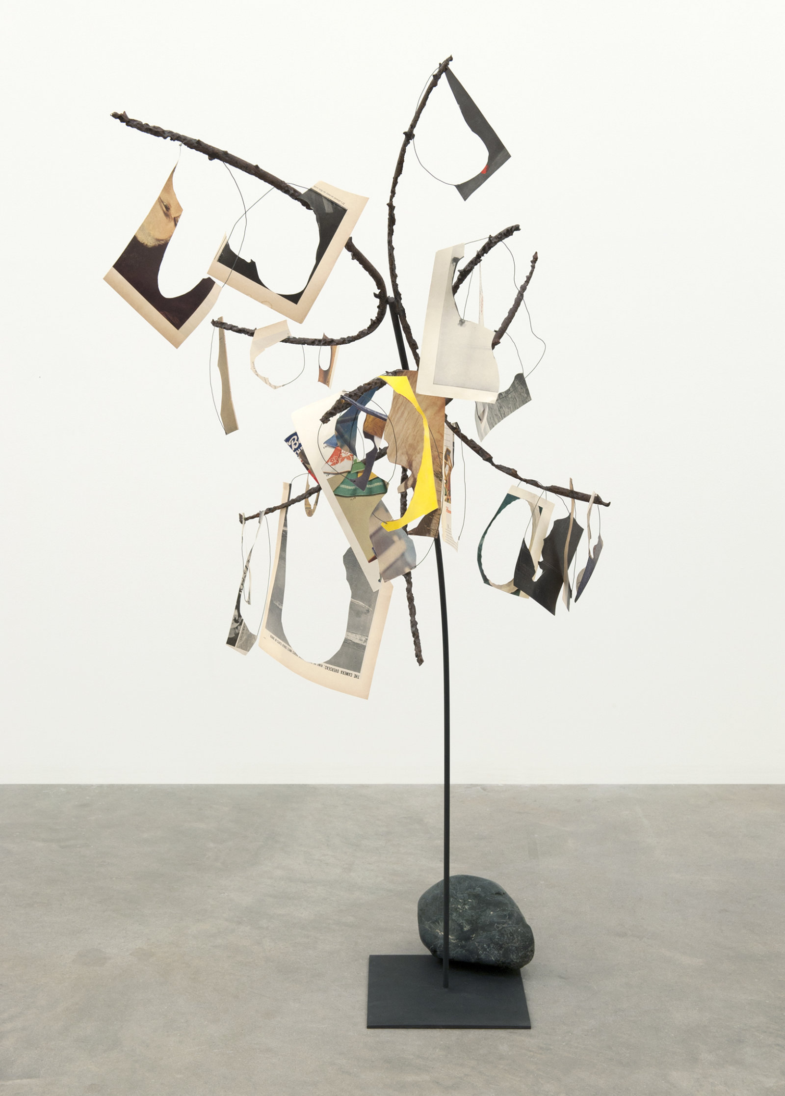 Geoffrey Farmer, Metal Will Stand Tall (A Single Image Is Not A Splendor), 2011–2012, found metal, LIFE Magazine cutouts, rock, wire, 69 x 39 x 28 in. (175 x 99 x 71 cm)