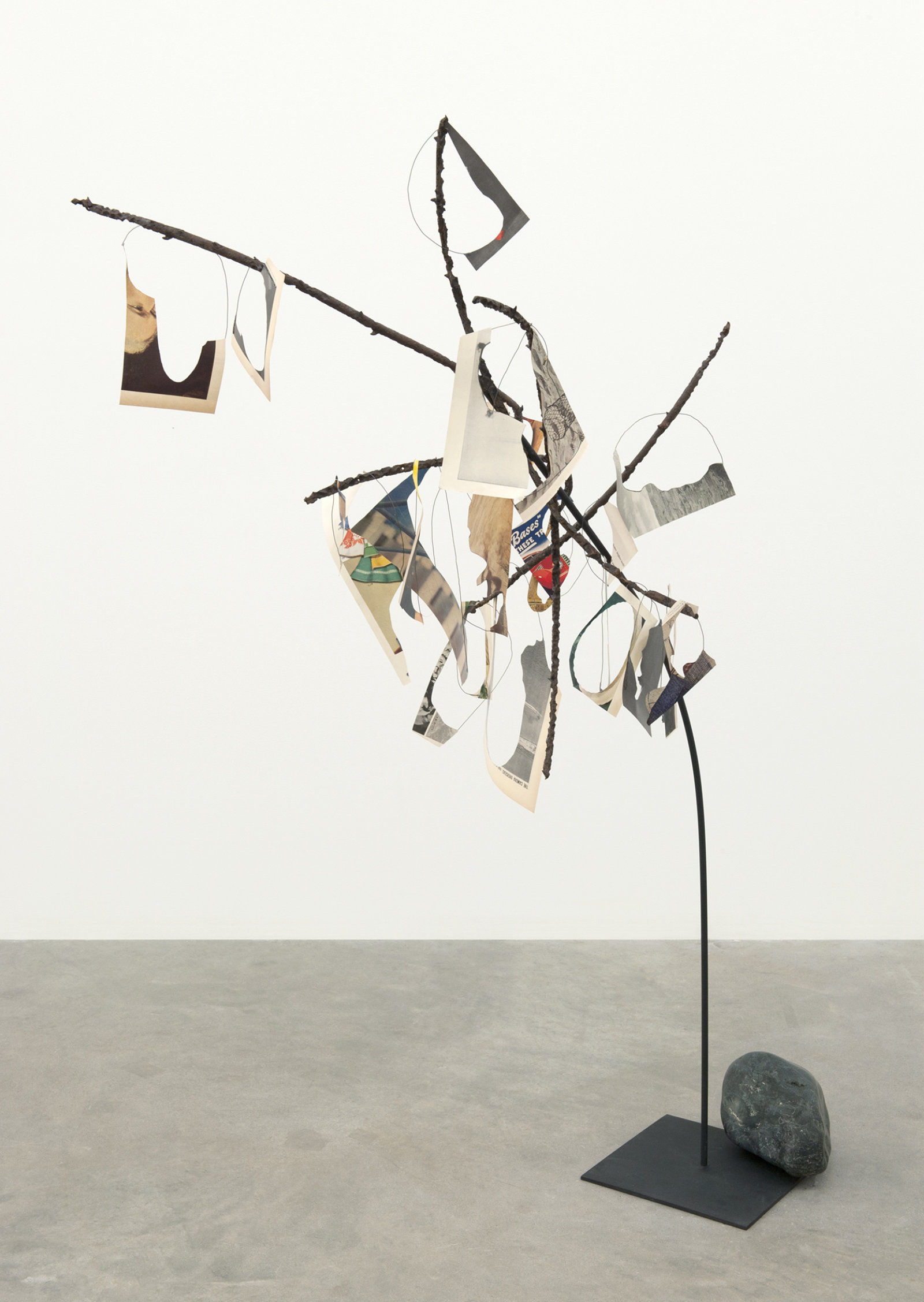 Geoffrey Farmer, Metal Will Stand Tall (A Single Image Is Not A Splendor), 2011–2012, found metal, LIFE Magazine cutouts, rock, wire, 69 x 39 x 28 in. (175 x 99 x 71 cm)