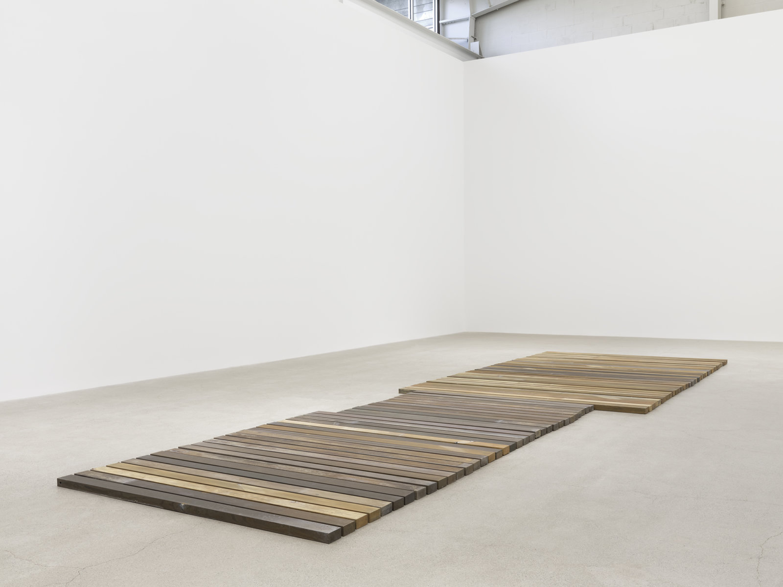 Geoffrey Farmer, 70 Planks, 2021, acid-etched brass planks, 3 x 100 x 321 in. (6 x 253 x 815 cm)