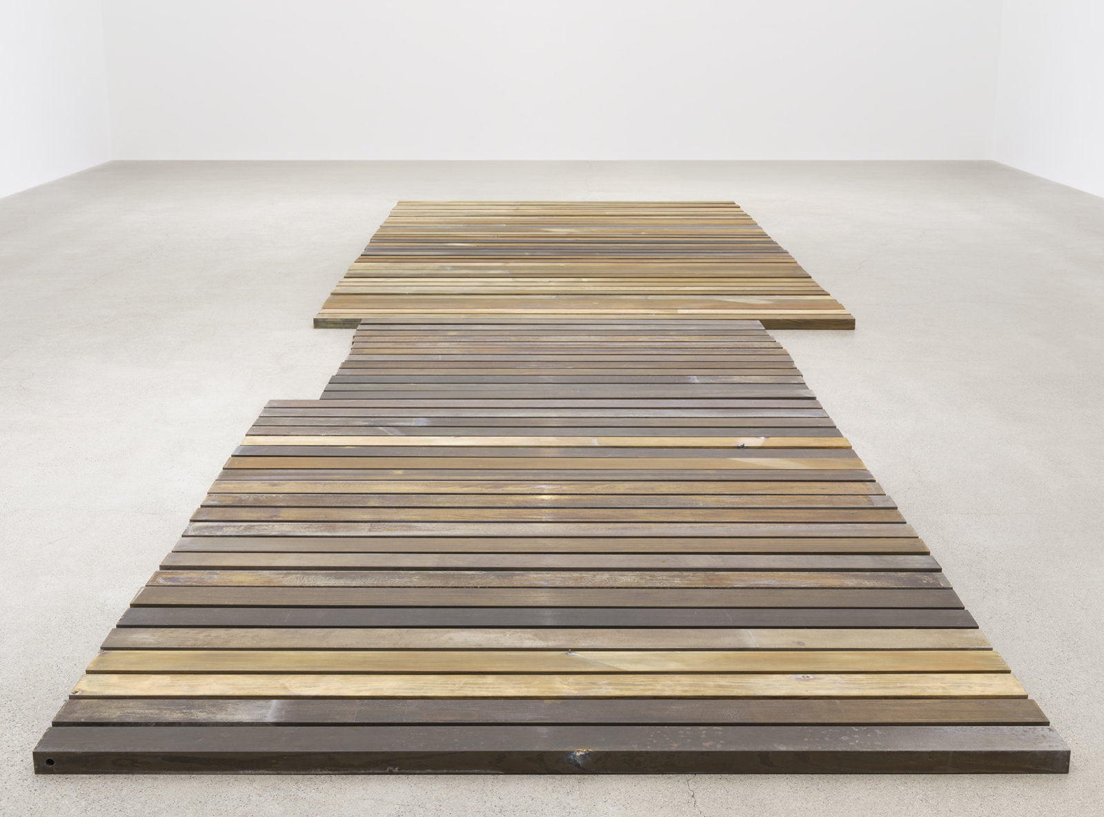 Geoffrey Farmer, 70 Planks, 2021, acid-etched brass planks, 3 x 100 x 321 in. (6 x 253 x 815 cm)