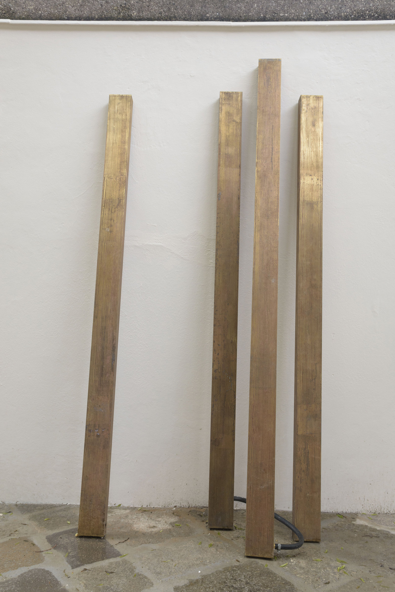 Geoffrey Farmer, Planks, 2017, acid etched brass, water works, each 2 x 4 x 76 in. (5 x 10 x 200 cm). Installation view, A way out of the mirror, Canada Pavilion, 57th Venice Biennale, Venice, Italy