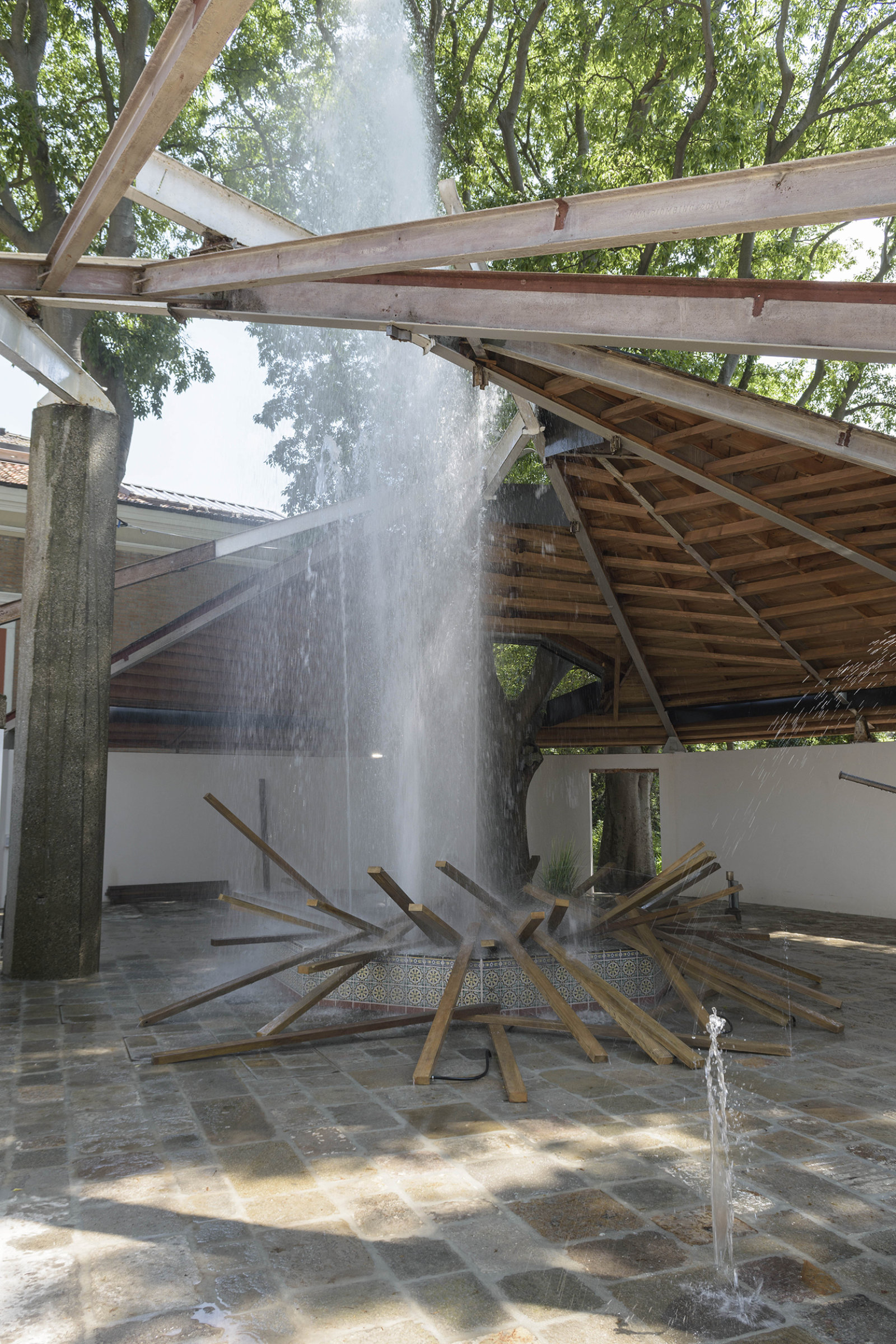 Geoffrey Farmer, SFAI Fountain, 2017, resin structure covered by ceramic tiles, artificial plants, acid-etched brass, waterworks, 150 x 150 x 19 in. (381 x 381 x 47 cm). Installation view, A way out of the mirror, Canada Pavilion, 57th Venice Biennale, Venice, Italy