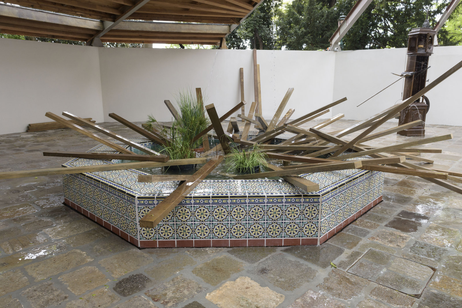 Geoffrey Farmer, SFAI Fountain, 2017, resin structure covered by ceramic tiles, artificial plants, acid-etched brass, waterworks, 150 x 150 x 19 in. (381 x 381 x 47 cm). Installation view, A way out of the mirror, Canada Pavilion, 57th Venice Biennale, Venice, Italy