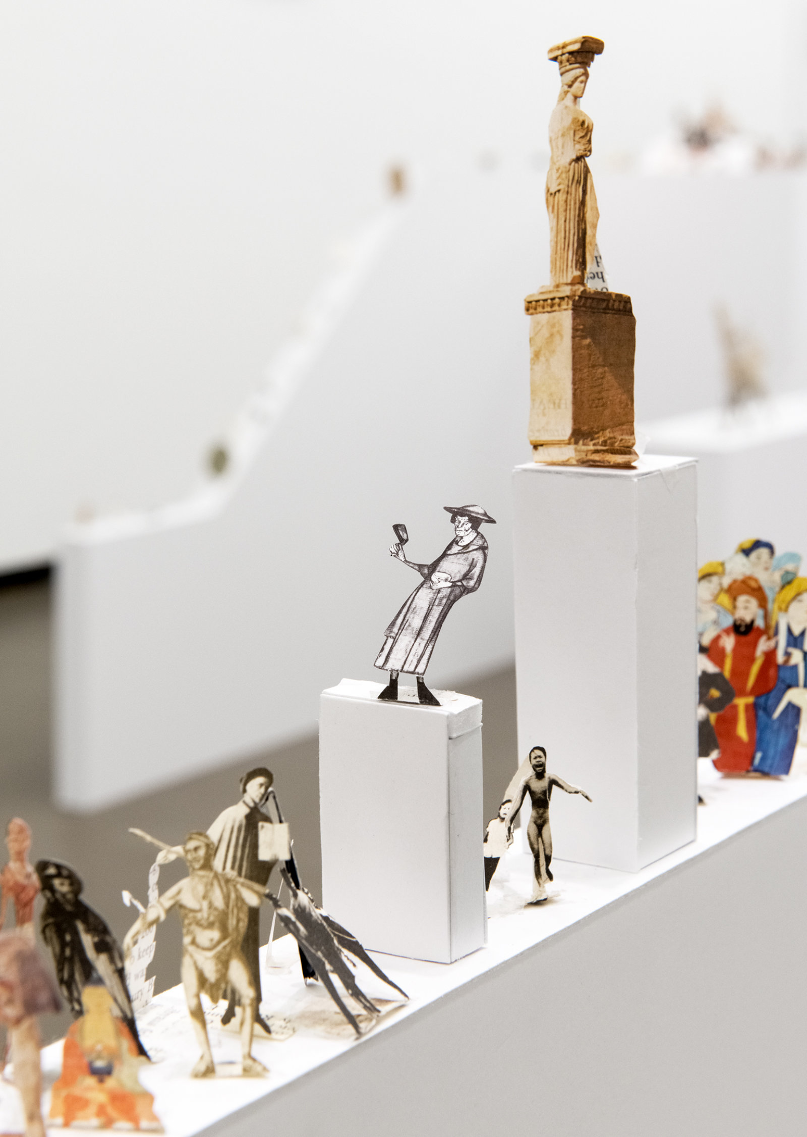 Geoffrey Farmer, The Last Two Million Years, 2007, foamcore plinths, perspex frames and cutouts from selected pages of the history book The Last Two Million Years, dimensions variable. Installation view, How Do I Fit This Ghost in My Mouth?, Vancouver Art Gallery, 2015