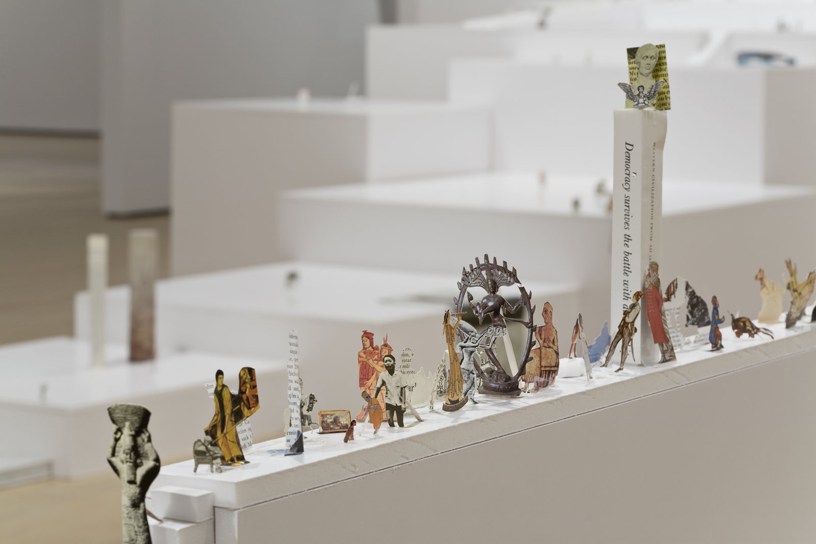 Geoffrey Farmer, The Last Two Million Years, 2007, foamcore plinths, perspex frames and cutouts from selected pages of the history book The Last Two Million Years, dimensions variable. Installation view, Musée d'art contemporain de Montréal, 2008