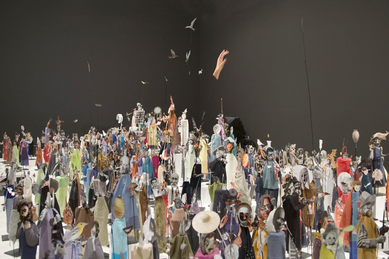 Geoffrey Farmer, The Surgeon and the Photographer, 2009, paper, textile, wood, and metal, 365 figures, dimensions variable. Installation view, Nomads, National Gallery of Canada, Toronto, 2009