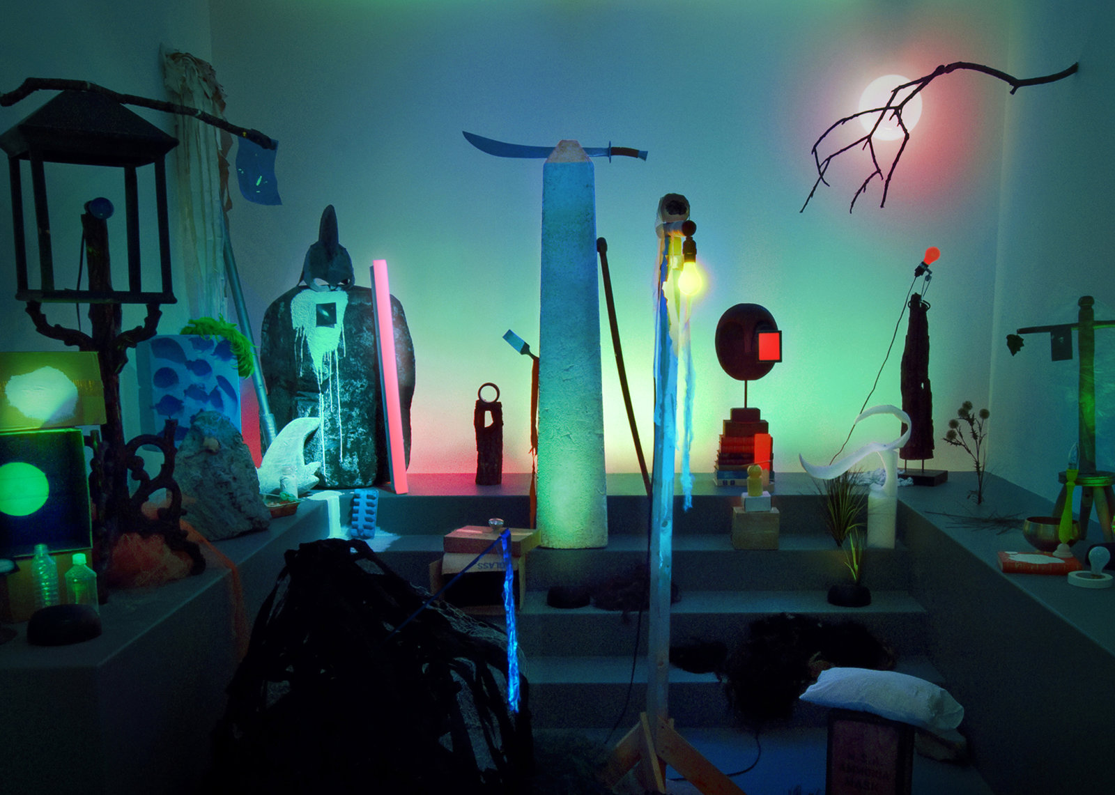 Geoffrey Farmer, Theatre of Cruelty, 2008, props, found objects, fabric, computer-controlled LED lighting system, speakers, framed photographs, dimensions variable