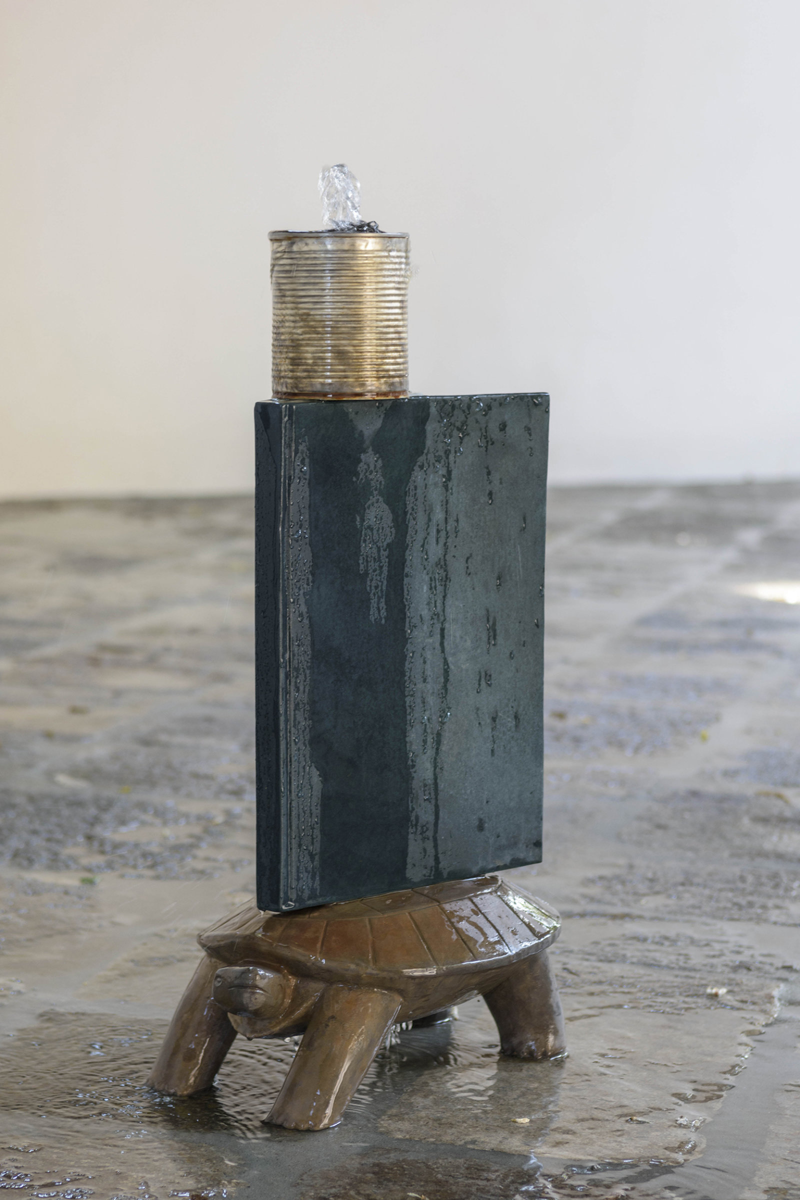 Geoffrey Farmer, Turtle, 2017, cast bronze, tin can, waterworks, 28 x 12 x 9 in. (70 x 30 x 22 cm). Installation view, A way out of the mirror, Canada Pavilion, 57th Venice Biennale, Venice, Italy