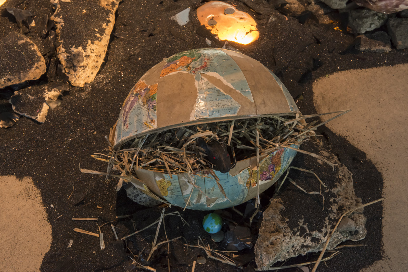 Kasper Feyrer, Device for sensing habitable zones (detail), 2018, copper slag, latex, wax, worbla, paper, fur, feather, amaranth seed, plaster, gelatin, gummies, globe, rat toy, hay, dried weeds, silicone, wire mesh, coins, mineral rocks, fused glass faces, rocks, concrete, motor, 136 x 109 x 108 in. (354 x 277 x 274 cm)