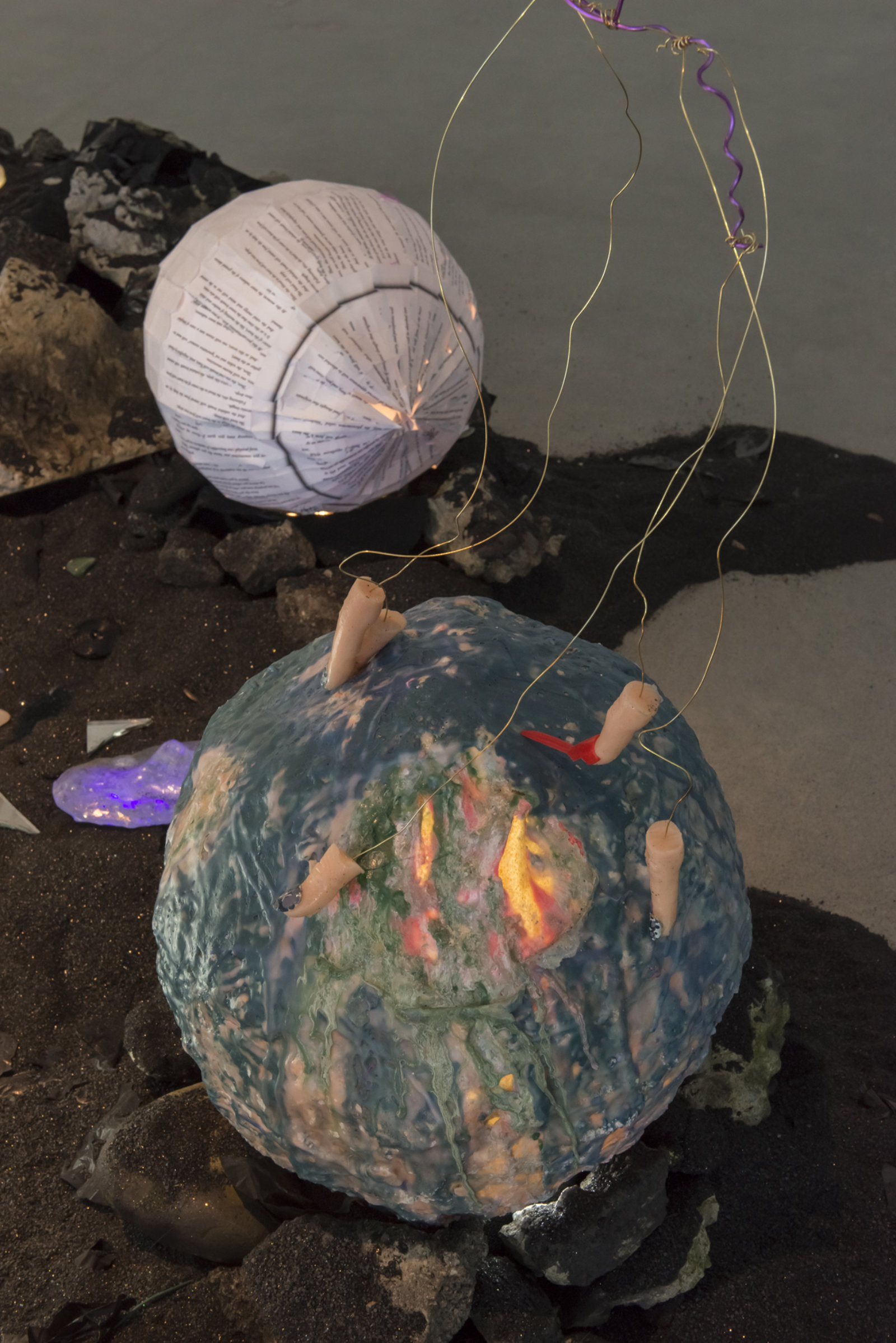 Kasper Feyrer, Device for sensing habitable zones (detail), 2018, copper slag, latex, wax, worbla, paper, fur, feather, amaranth seed, plaster, gelatin, gummies, globe, rat toy, hay, dried weeds, silicone, wire mesh, coins, mineral rocks, fused glass faces, rocks, concrete, motor, 136 x 109 x 108 in. (354 x 277 x 274 cm)