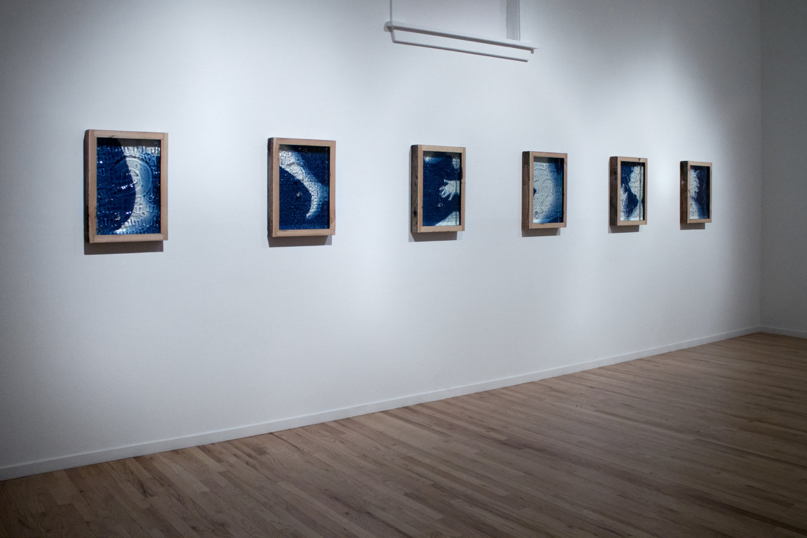 Kasper Feyrer, The Pedestrians: Left Head, Right Head, Left Body, Right Body, Left Foot, Right Foot, 2014, 6 cyanotypes, dice, aged fir, mirror inlay, each 22 x 16 x 3 inches (56 x 41 x 8 cm)